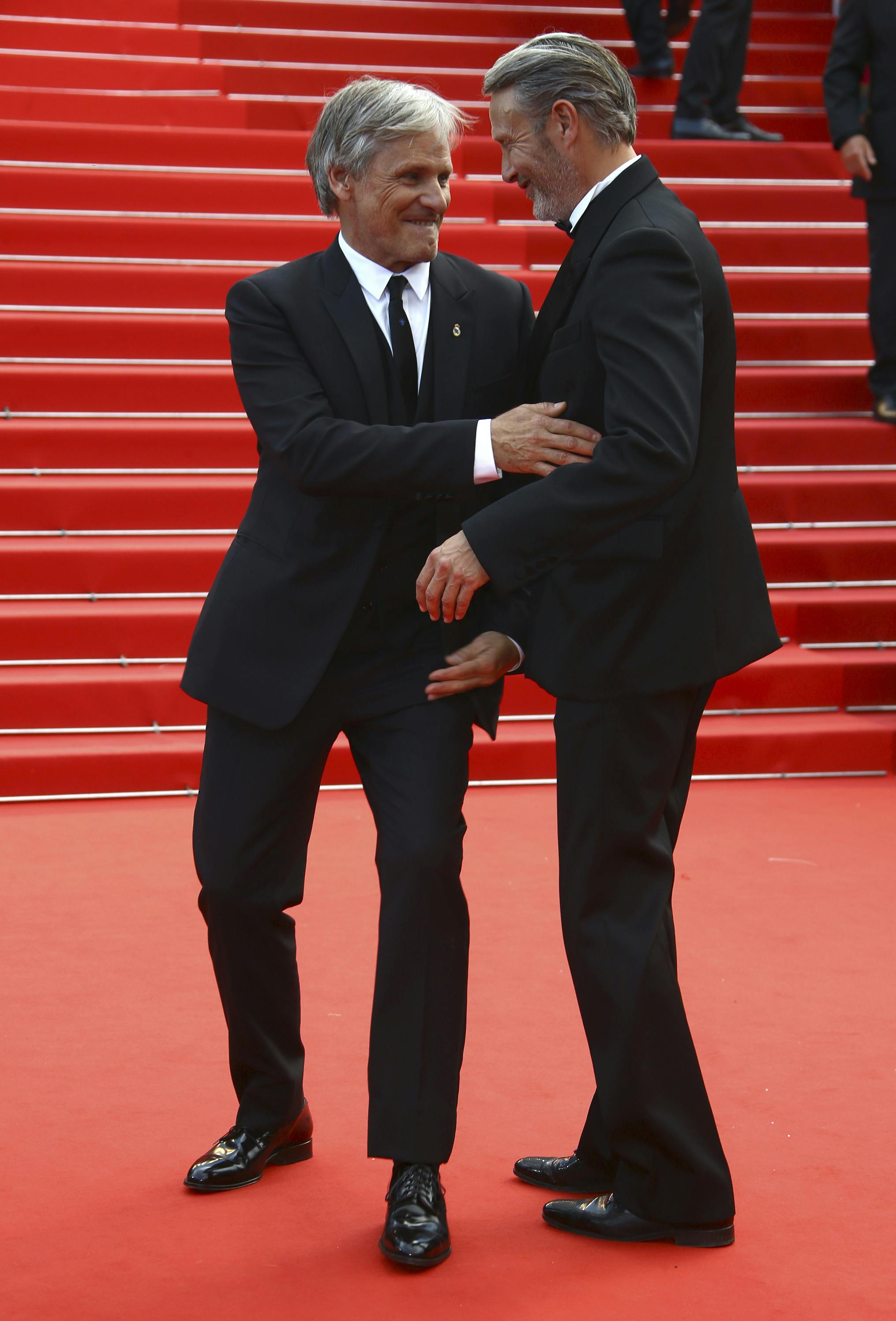 Viggo Mortensen, left, and Mads Mikkelsen pose for photographers upon arrival at the 75th anniversary celebration of the Cannes film festival and the premiere of the film 'The Innocent' at the 75th international film festival, Cannes, southern France, Tuesday, May 24, 2022. (Photo by Joel C Ryan/Invision/AP)