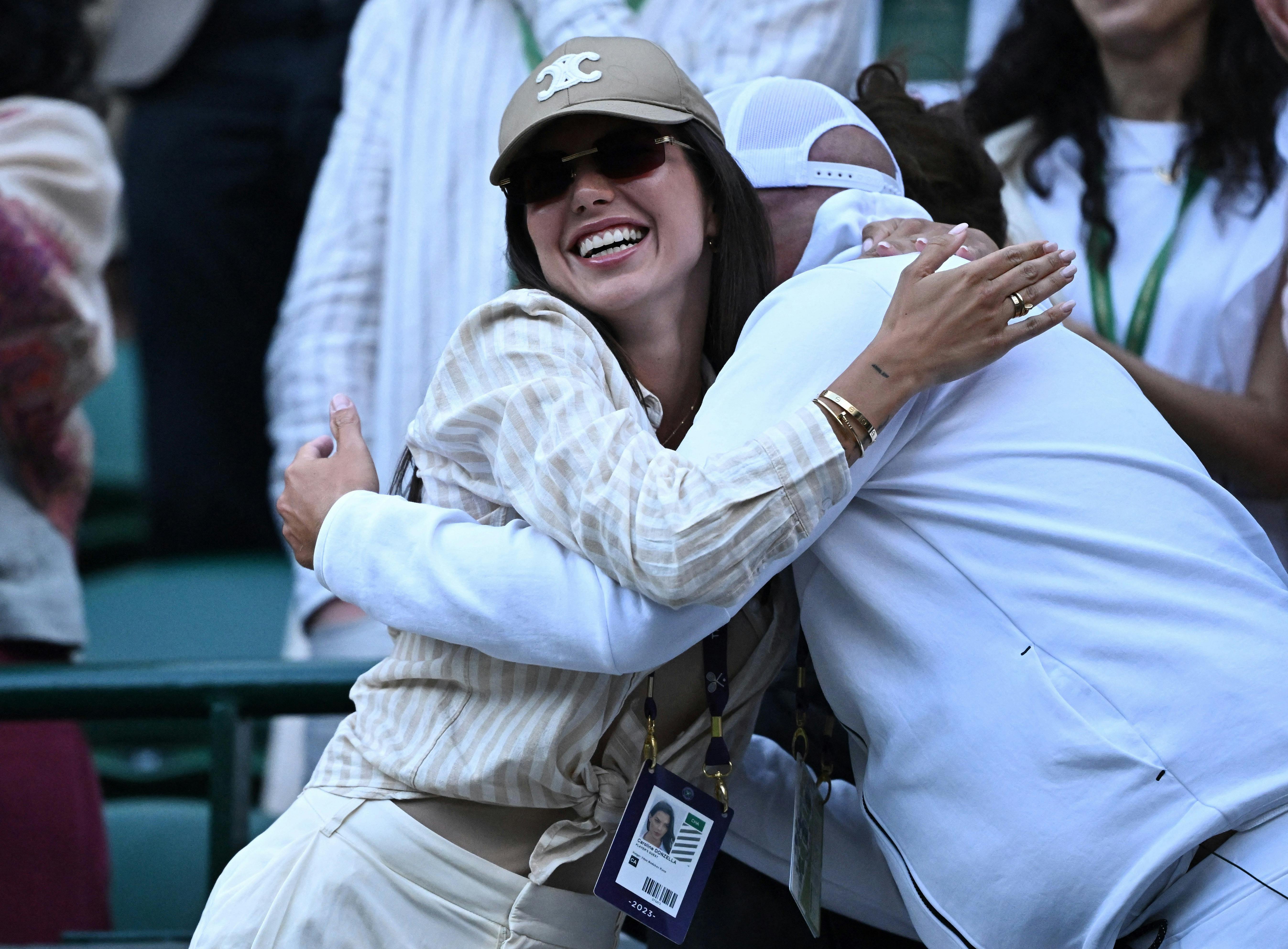 Tennis - Wimbledon - All England Lawn Tennis and Croquet Club, London, Britain - July 10, 2023 Caroline Donzella celebrates after Denmark's Holger Rune won his fourth round match against Bulgaria's Grigor Dimitrov REUTERS/Dylan Martinez