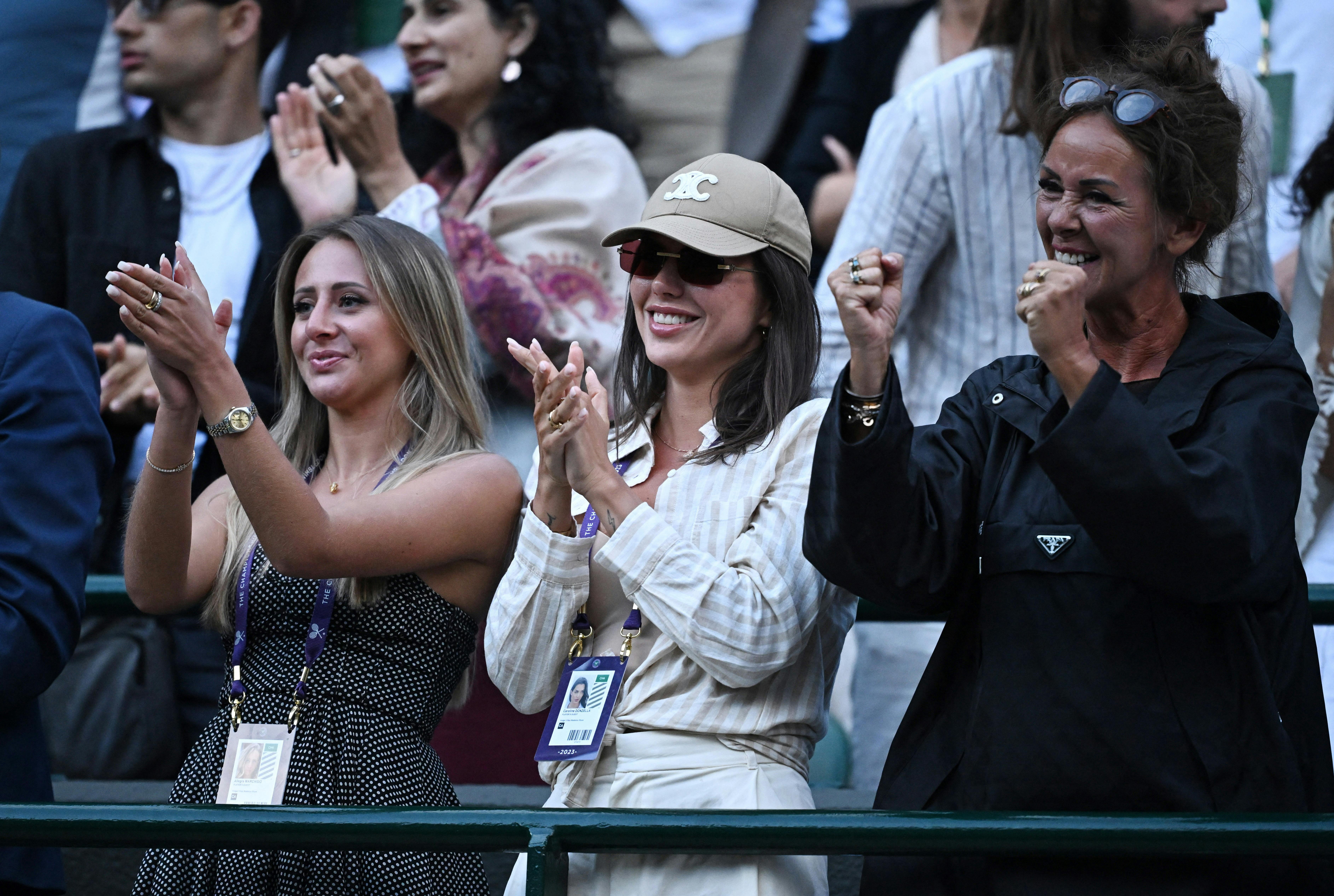 Tennis - Wimbledon - All England Lawn Tennis and Croquet Club, London, Britain - July 10, 2023 Aneke Rune, mother of Denmark's Holger Rune and Caroline Donzella celebrate after he won his fourth round match against Bulgaria's Grigor Dimitrov REUTERS/Dylan Martinez