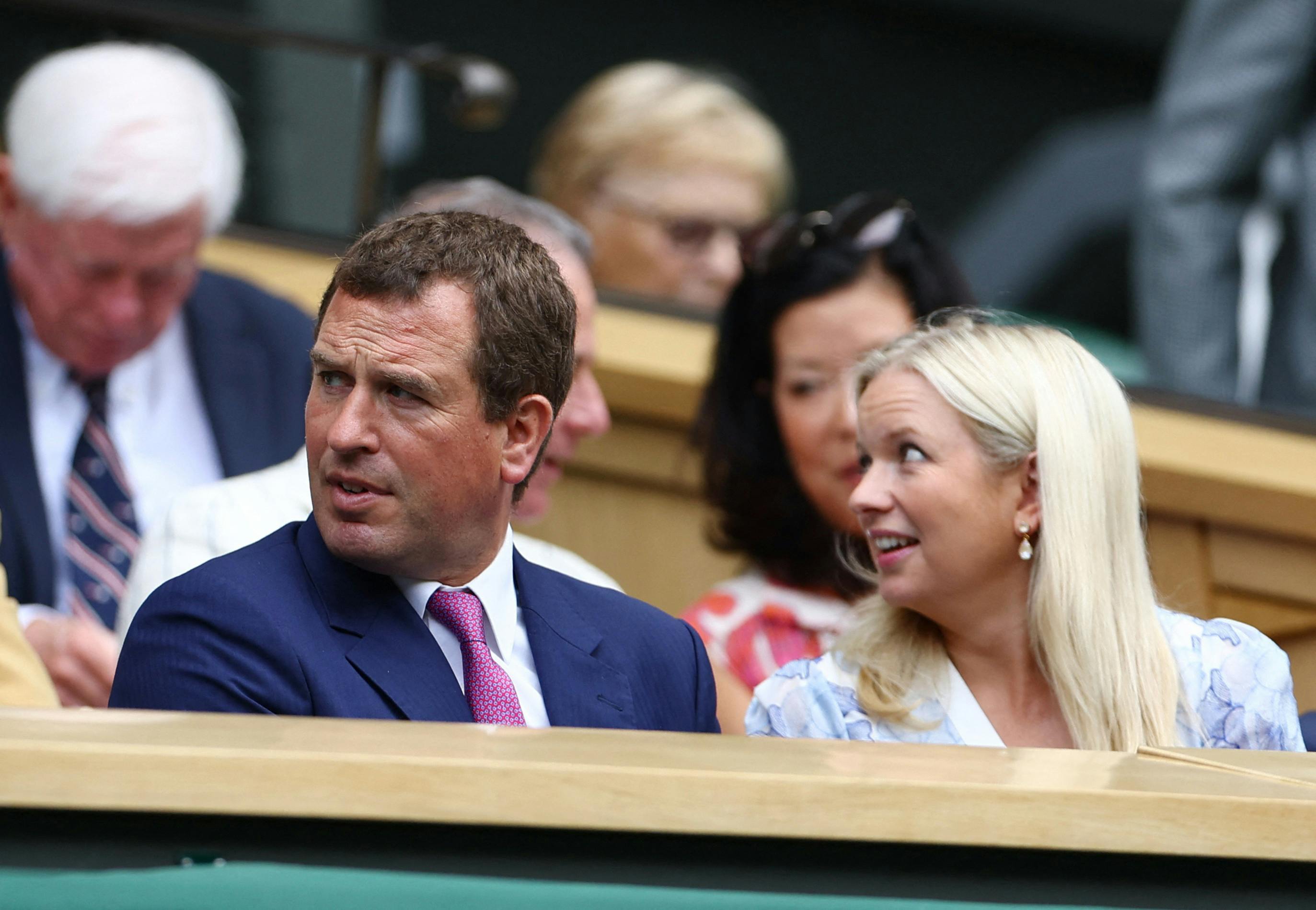 Tennis - Wimbledon - All England Lawn Tennis and Croquet Club, London, Britain - July 12, 2023 Peter Phillips with his partner Lindsay Wallace in the royal box on centre court before the start of play REUTERS/Hannah Mckay