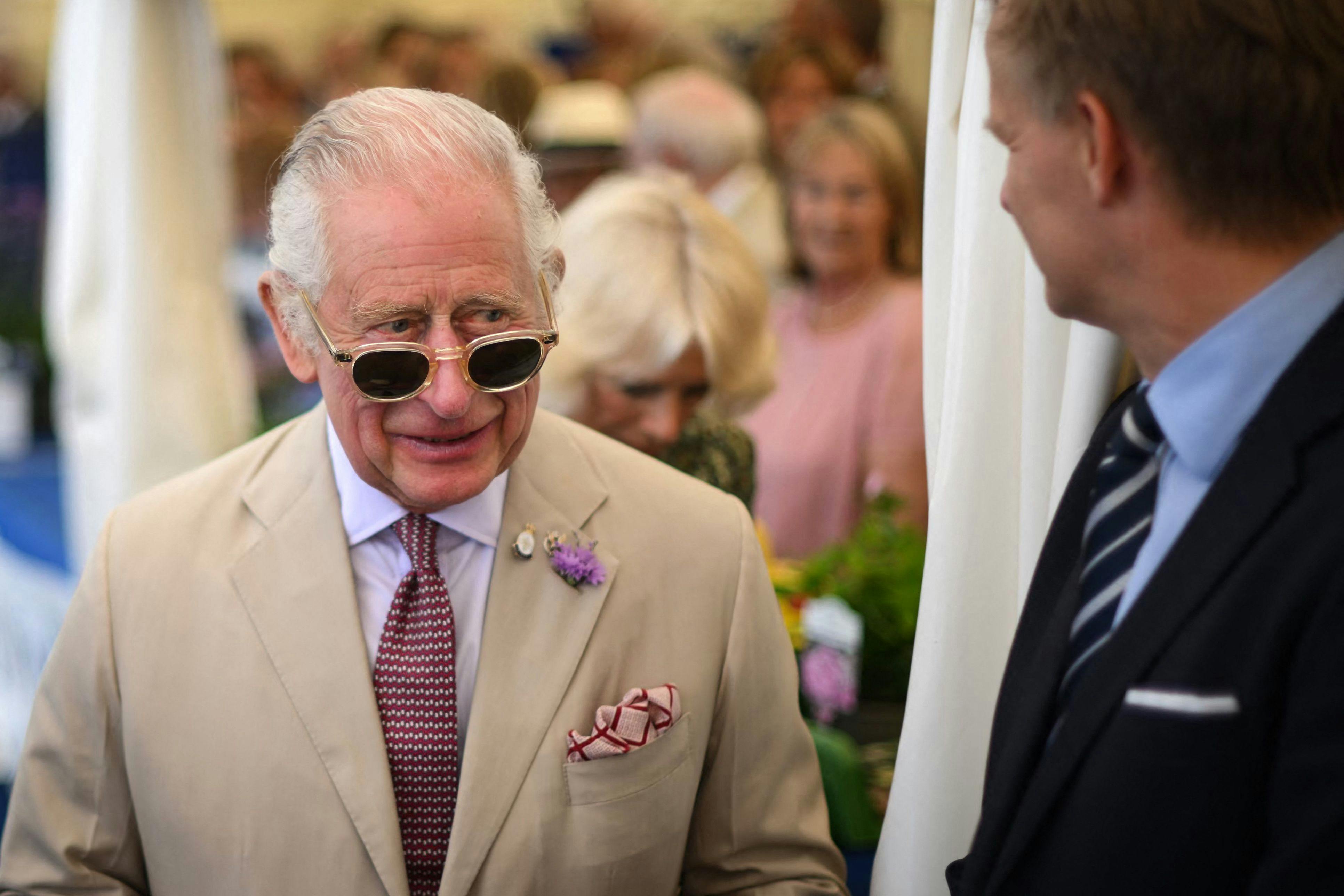 Britain's King Charles III reacts during a visit of the Sandringham Flower Show, in Sandrigham, north west England, on July 26, 2023. (Photo by Daniel LEAL / POOL / AFP)