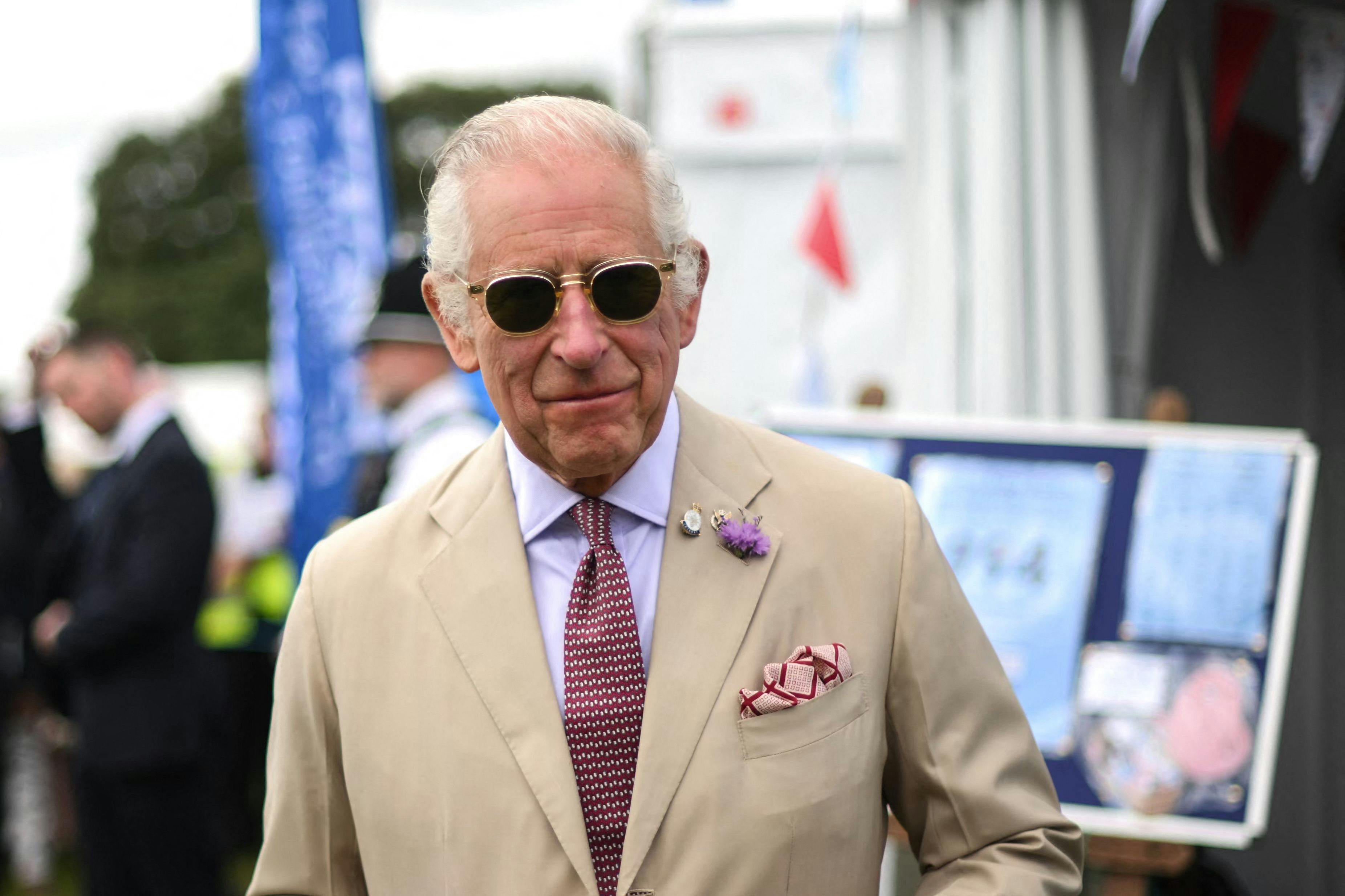 Britain's King Charles III reacts during a visit of the Sandringham Flower Show, in Sandrigham, north west England, on July 26, 2023. (Photo by Daniel LEAL / POOL / AFP)