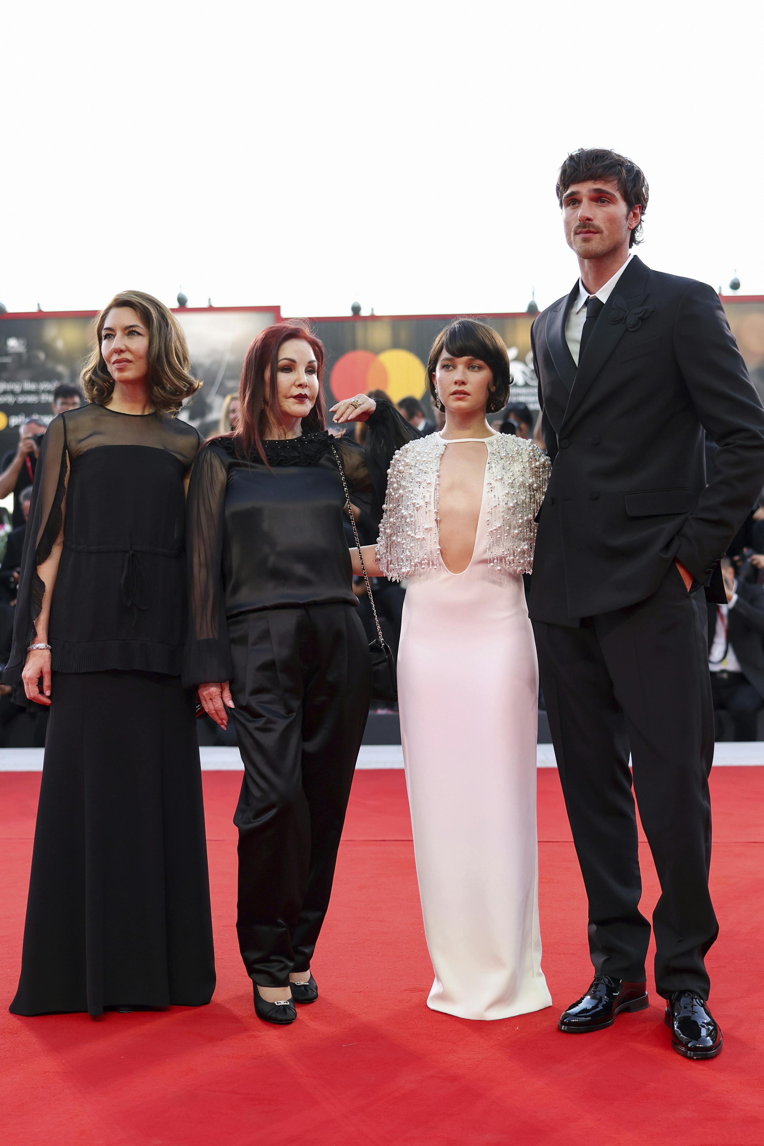 Director Sofia Coppola, from left, Priscilla Presley, Cailee Spaeny, and Jacob Elordi pose for photographers upon arrival for the premiere of the film 'Priscilla' during the 80th edition of the Venice Film Festival in Venice, Italy, on Monday, Sept. 4, 2023. (Photo by Vianney Le Caer/Invision/AP)