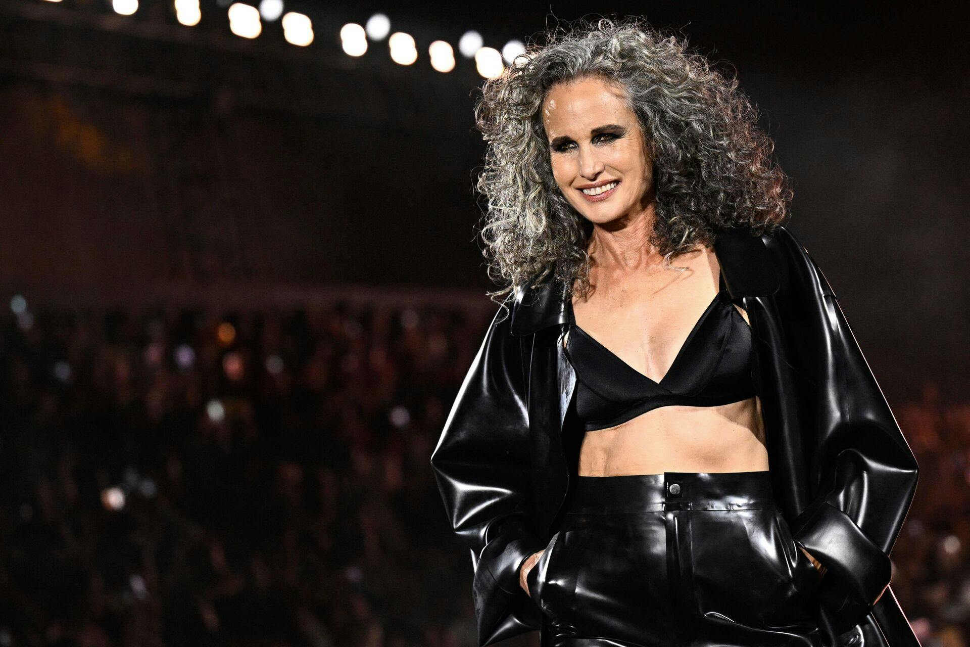 US actress Andie MacDowell presents a creation for L'Oreal Paris during a show as part of the Paris Fashion Week Womenswear Spring/Summer 2024 in Paris on October 1, 2023. (Photo by JULIEN DE ROSA / AFP)
