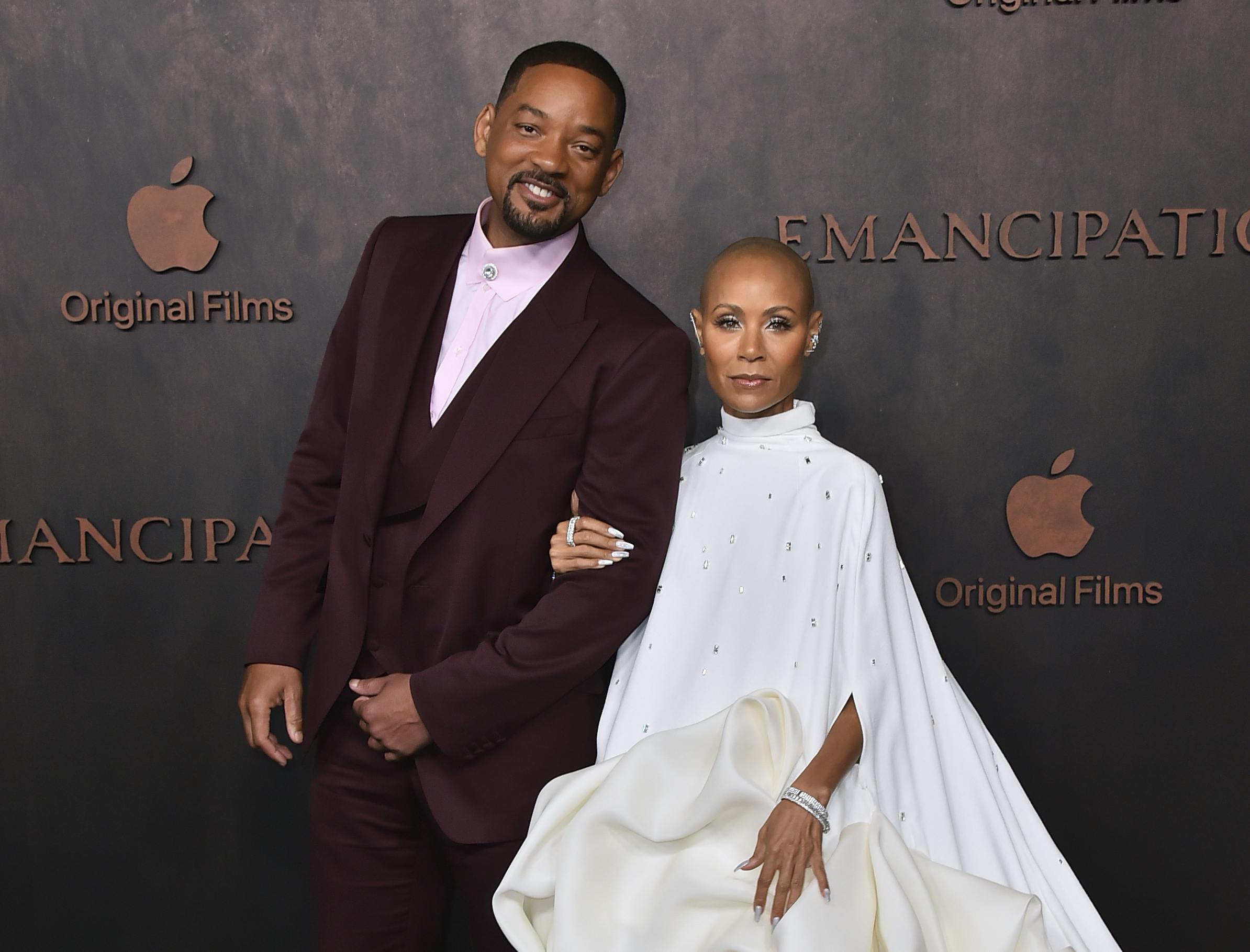 Will Smith, left, and Jada Pinkett Smith arrive at the premiere of "Emancipation, " Wednesday, Nov. 30, 2022, at the Regency Village Theatre in Los Angeles. (Photo by Jordan Strauss/Invision/AP)