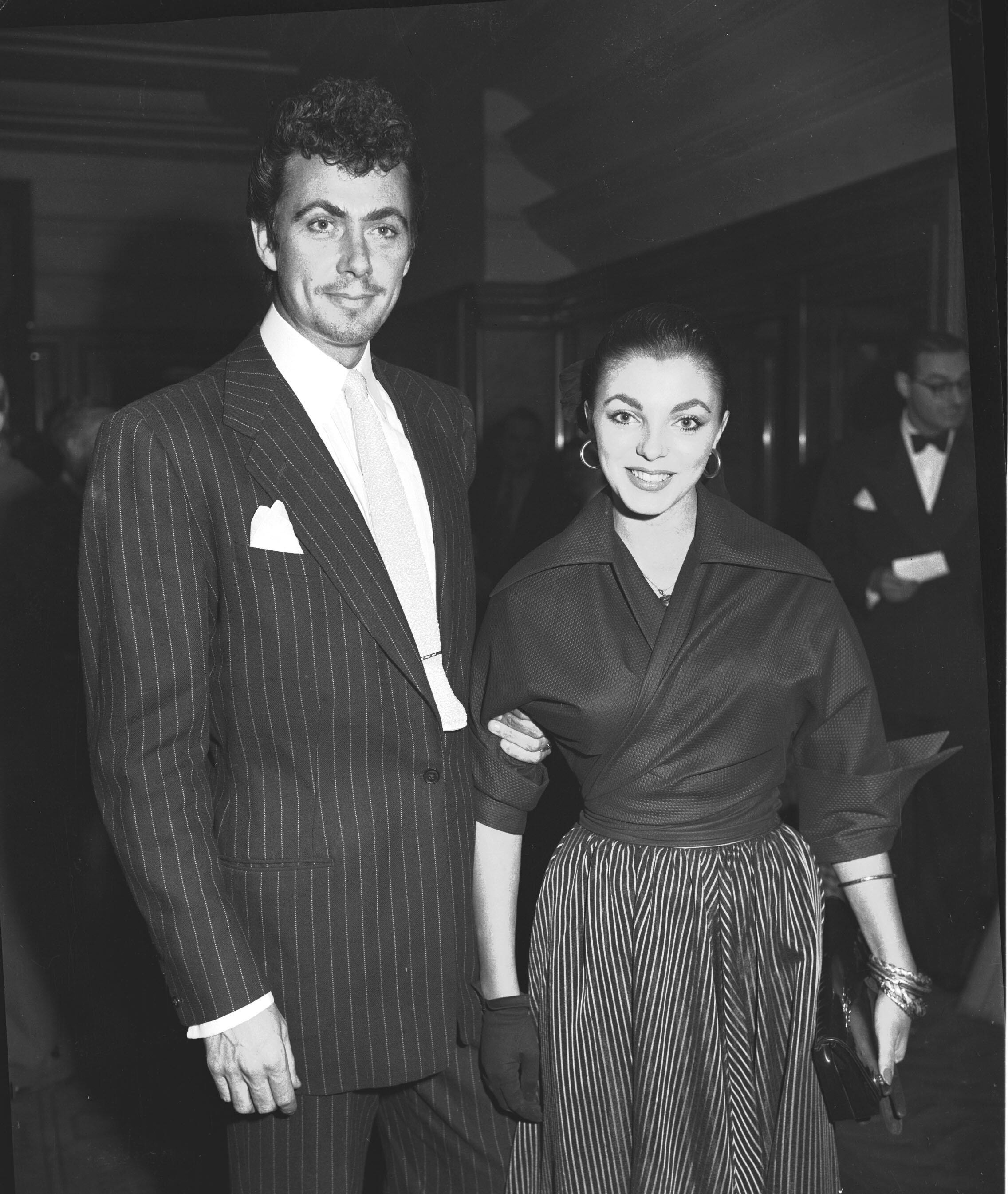 Actress Joan Collins and actor Maxwell Reed leave the register office after they were married, the day after her 19th birthday, at London's Caxton Hall Register Office on May 24, 1952. The couple went on to honeymoon in Spain. (AP Photo)
