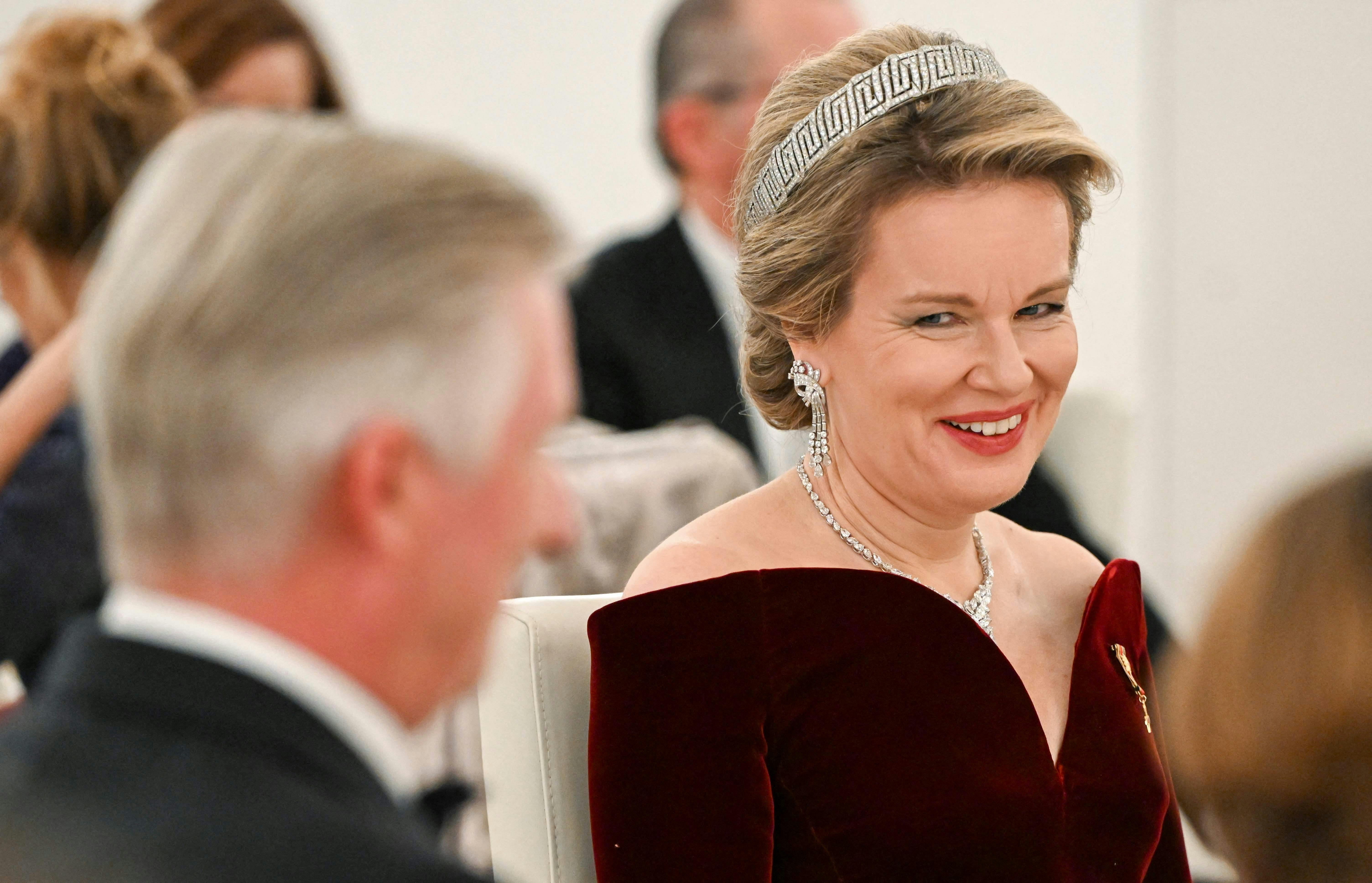 King Philippe - Filip of Belgium (L) and Queen Mathilde of Belgium are pictured during a state banquet at the presidential Bellevue Palace in Berlin, on December 5, 2023. (Photo by Jens Kalaene / POOL / AFP)