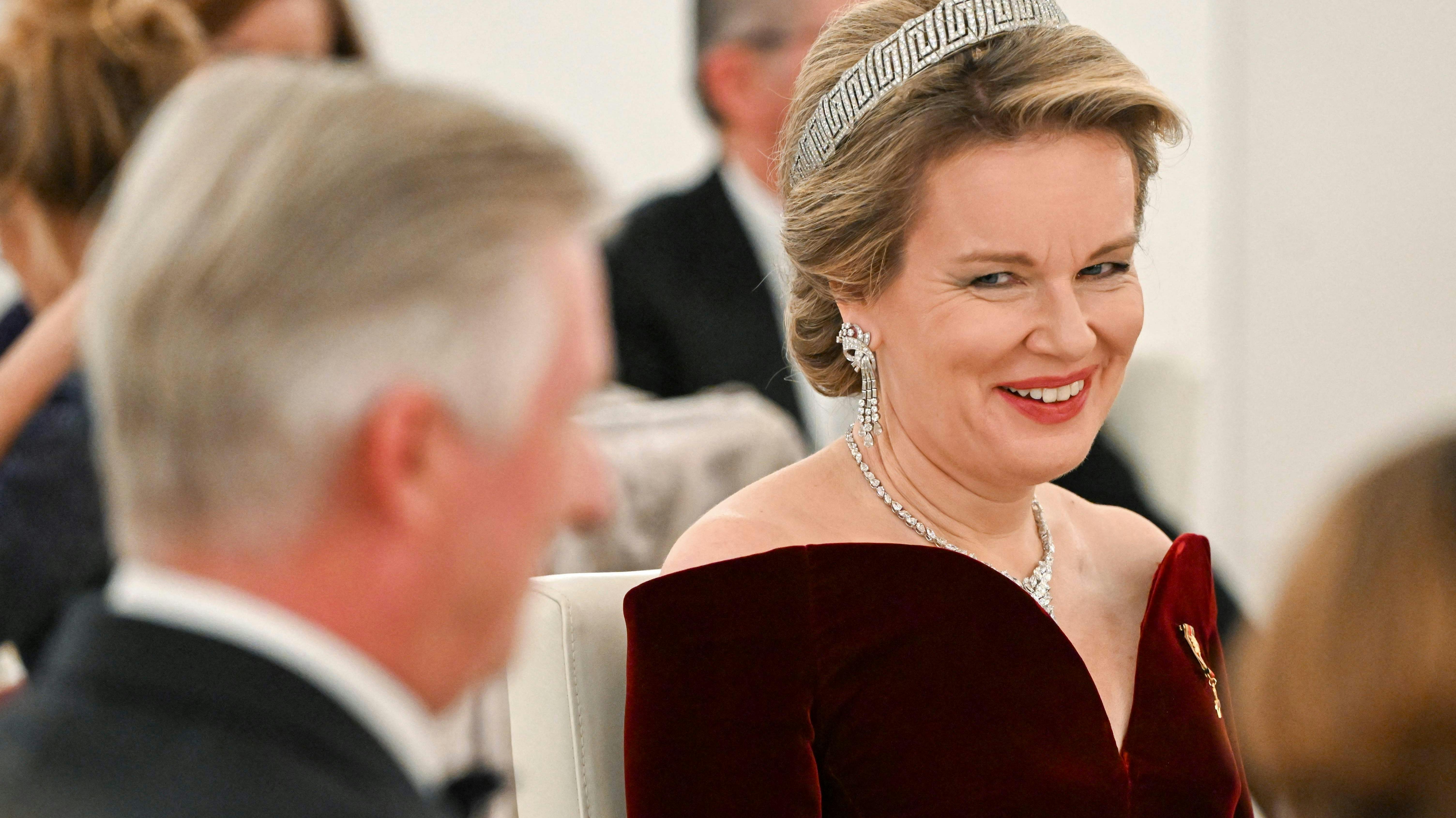 King Philippe - Filip of Belgium (L) and Queen Mathilde of Belgium are pictured during a state banquet at the presidential Bellevue Palace in Berlin, on December 5, 2023. (Photo by Jens Kalaene / POOL / AFP)