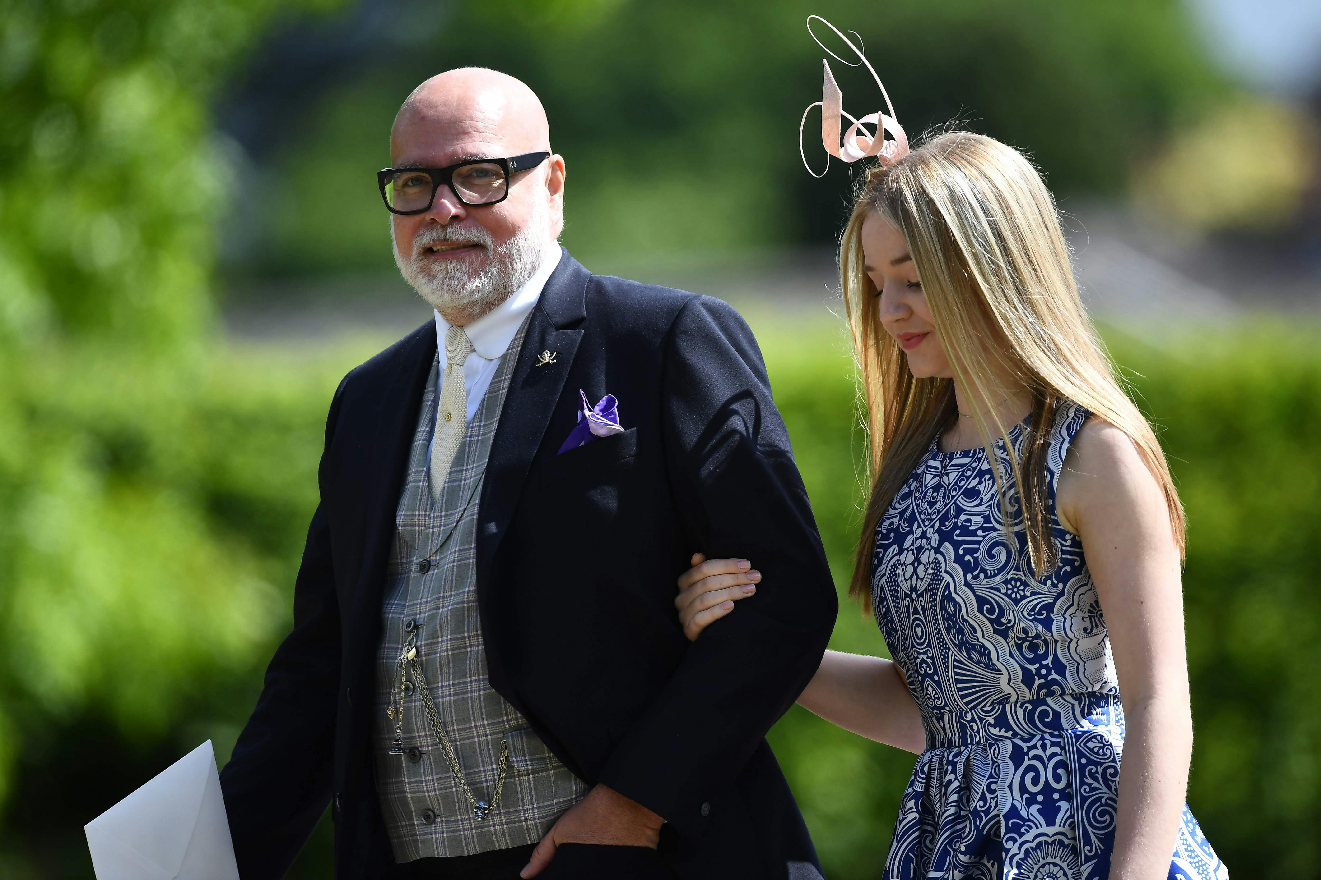 (FILES) This file photo taken on May 20, 2017 shows Gary Goldsmith (L), uncle of the bride, attending the wedding of Pippa Middleton and James Matthews at St Mark's Church in Englefield, west of London. Goldsmith, the Duchess of Cambridge's uncle has admitted punching his wife in the face and knocking her to the ground after a drunken row on November 14, 2017 in court in central London. / AFP PHOTO / POOL / Justin TALLIS