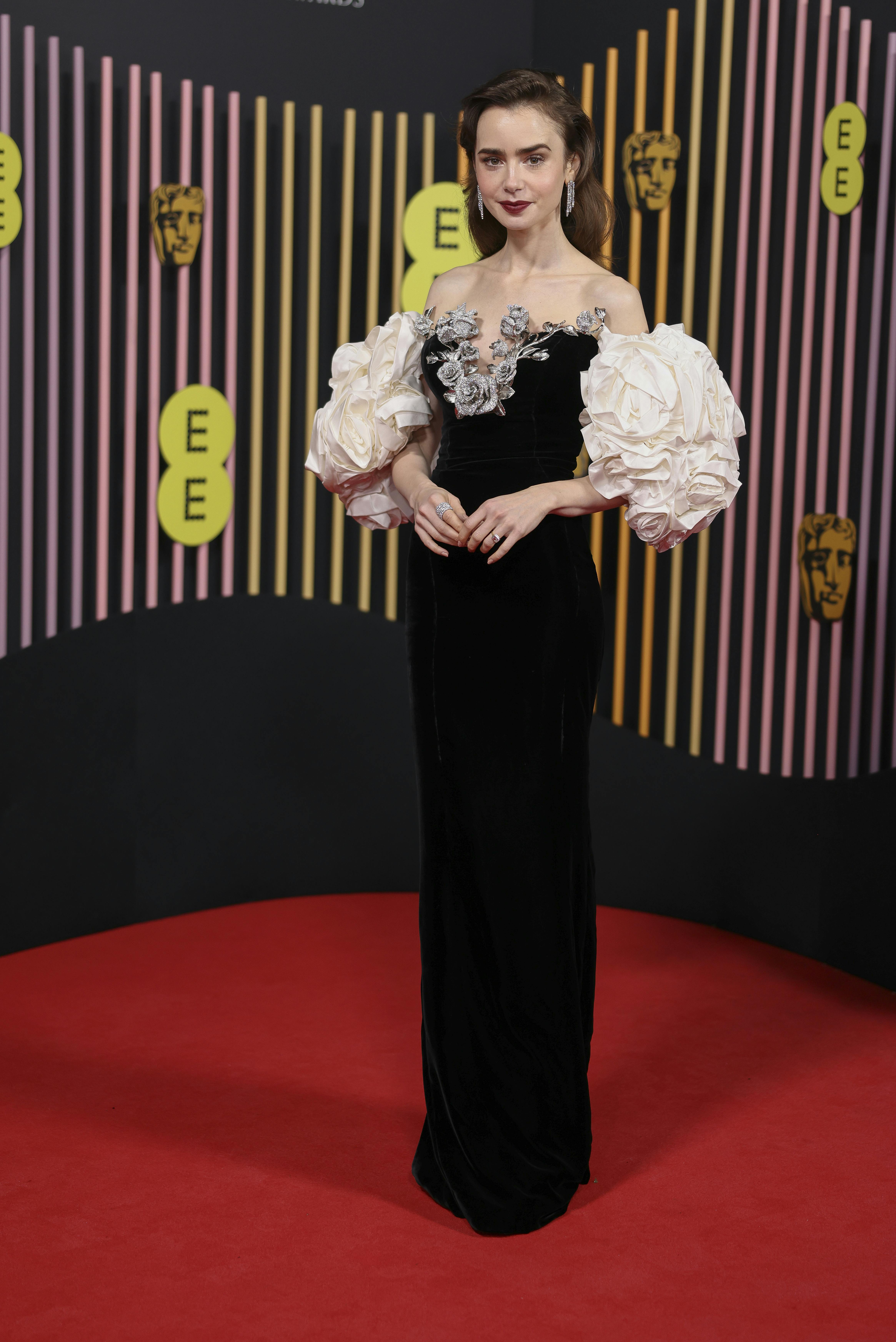 Lily Collins poses for photographers upon arrival at the 77th British Academy Film Awards, BAFTA's, in London, Sunday, Feb. 18, 2024. (Photo by Vianney Le Caer/Invision/AP)