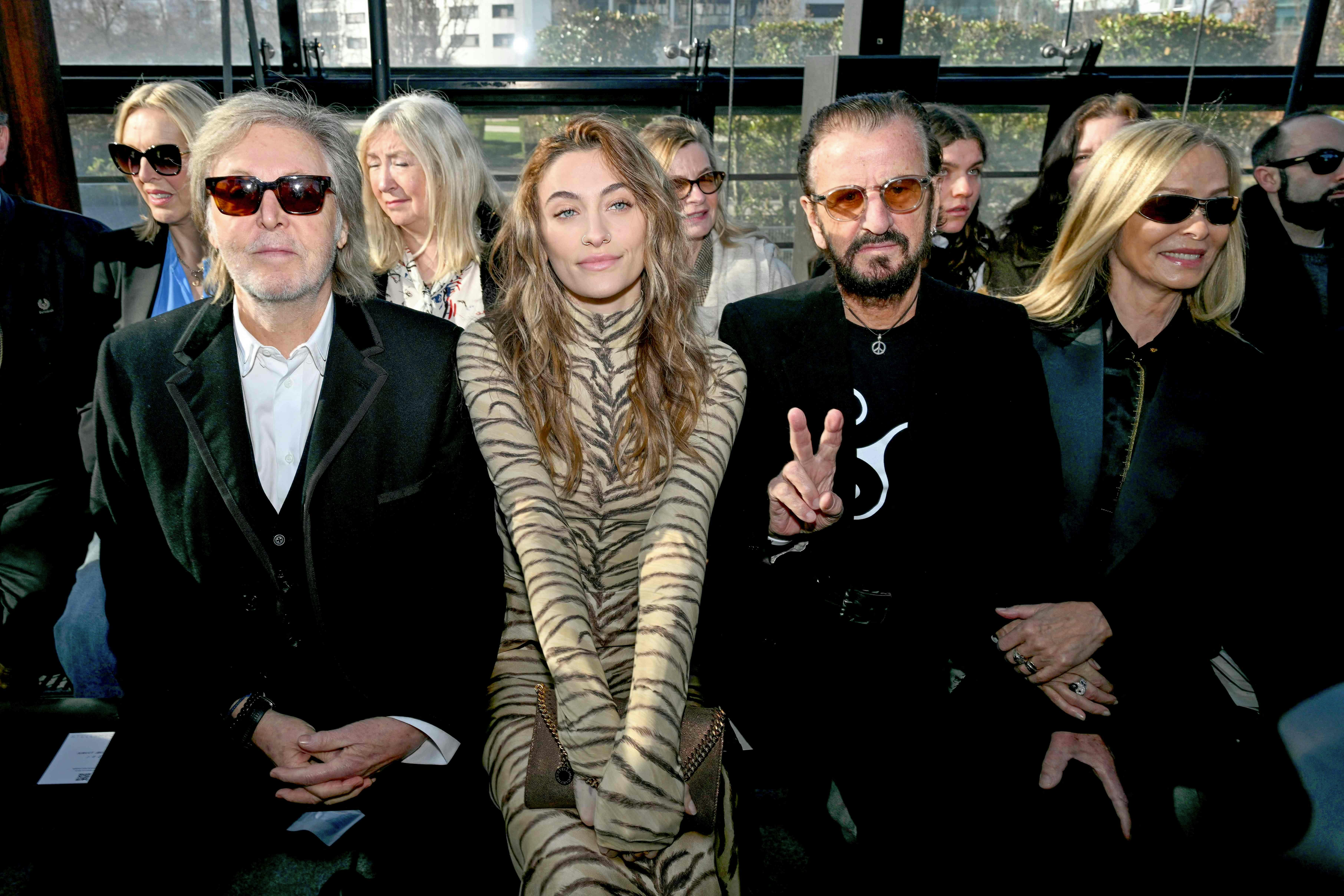 (L-R) British rock singer Sir Paul McCartney , US model and actress Paris Jackson, British rock musician Sir Ringo Star and his wife US actress Barbara Bach attend ahead of the presentation of creations by Stella McCartney for the Women Ready-to-wear Fall-Winter 2024/2025 collection as part of the Paris Fashion Week, in Paris on March 4, 2024. (Photo by MIGUEL MEDINA / AFP)