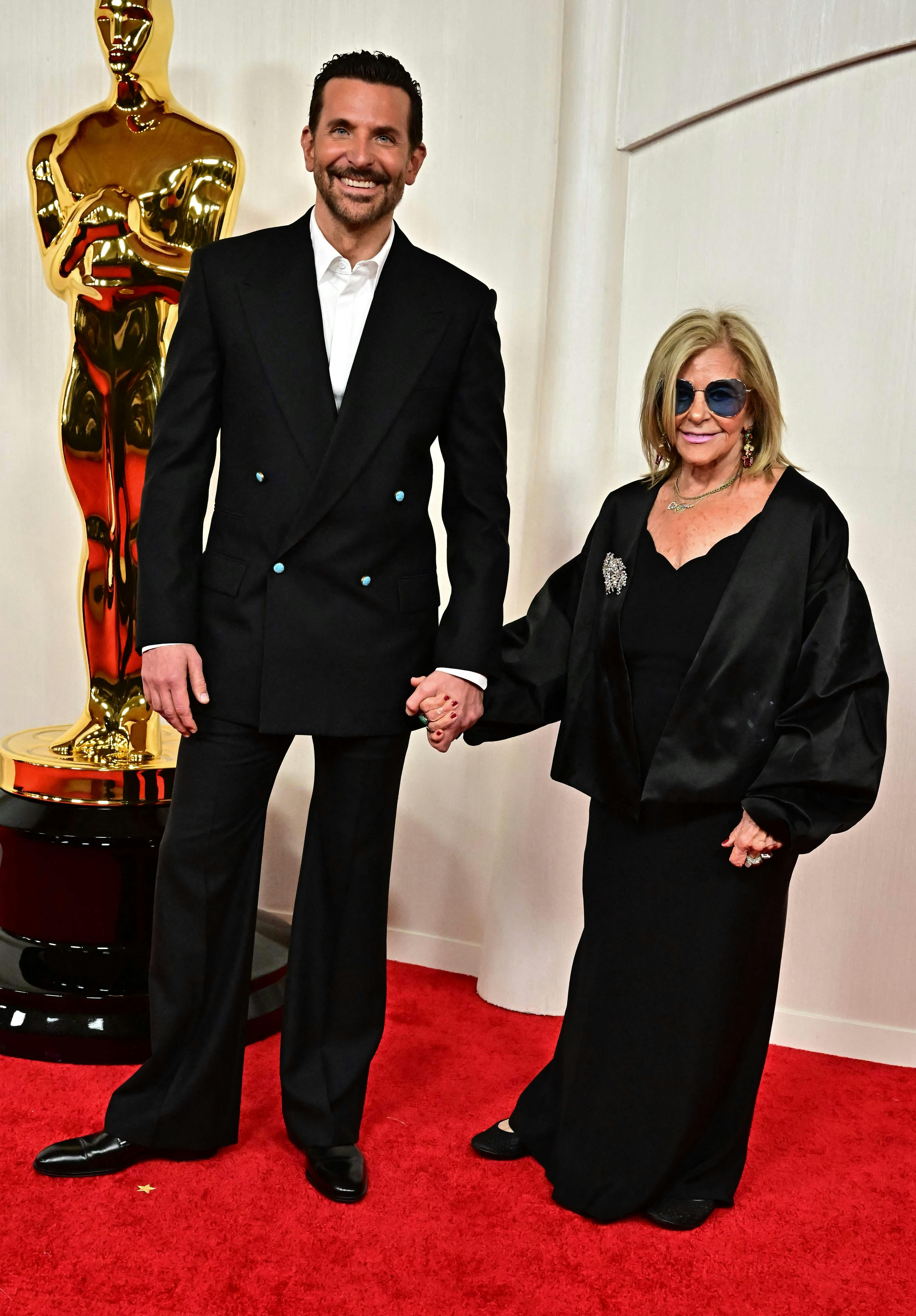 US actor and director Bradley Cooper and his mother Gloria Campano attend the 96th Annual Academy Awards at the Dolby Theatre in Hollywood, California on March 10, 2024. (Photo by Frederic J. Brown / AFP)