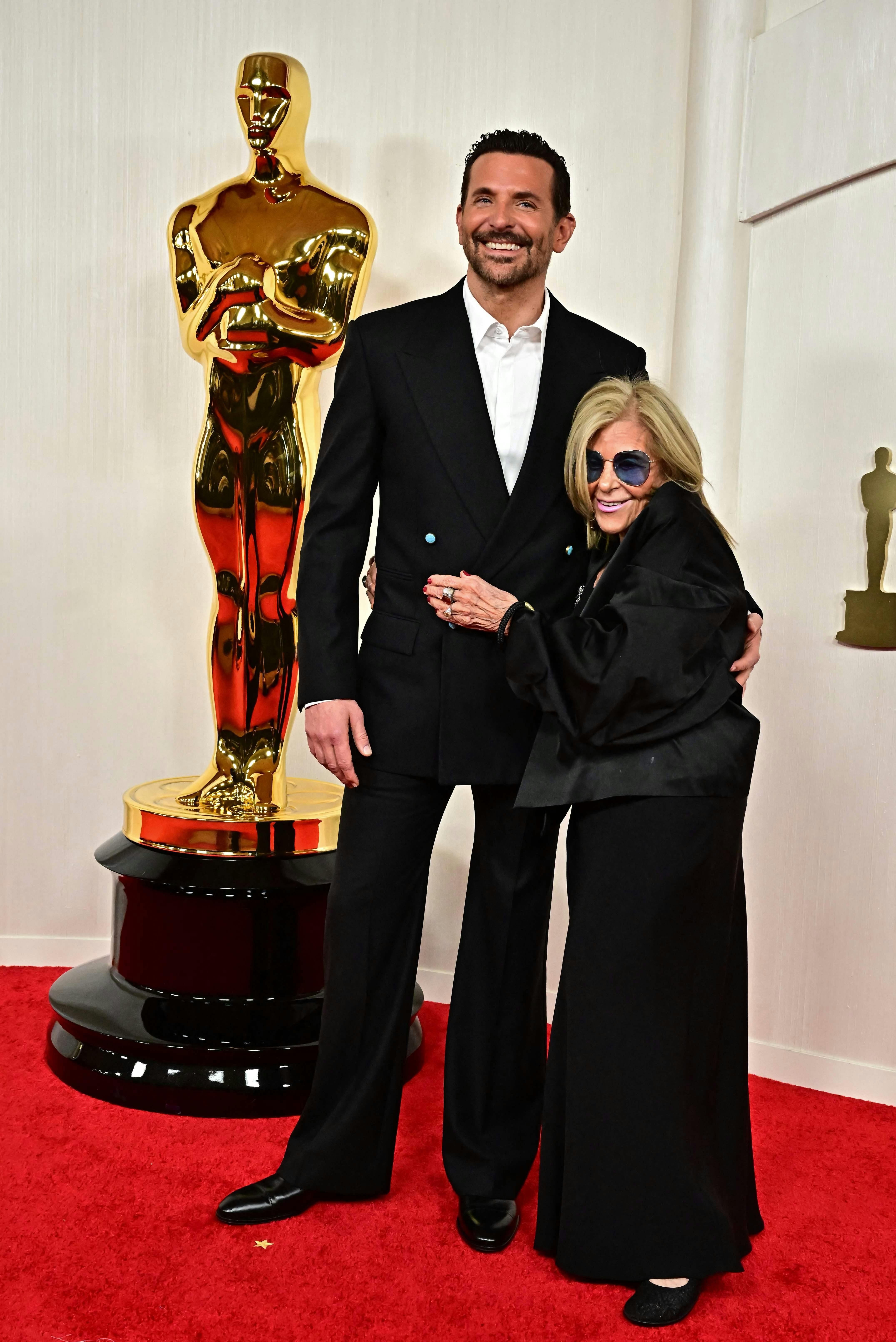 US actor and director Bradley Cooper and his mother Gloria Campano attend the 96th Annual Academy Awards at the Dolby Theatre in Hollywood, California on March 10, 2024. (Photo by Frederic J. Brown / AFP)