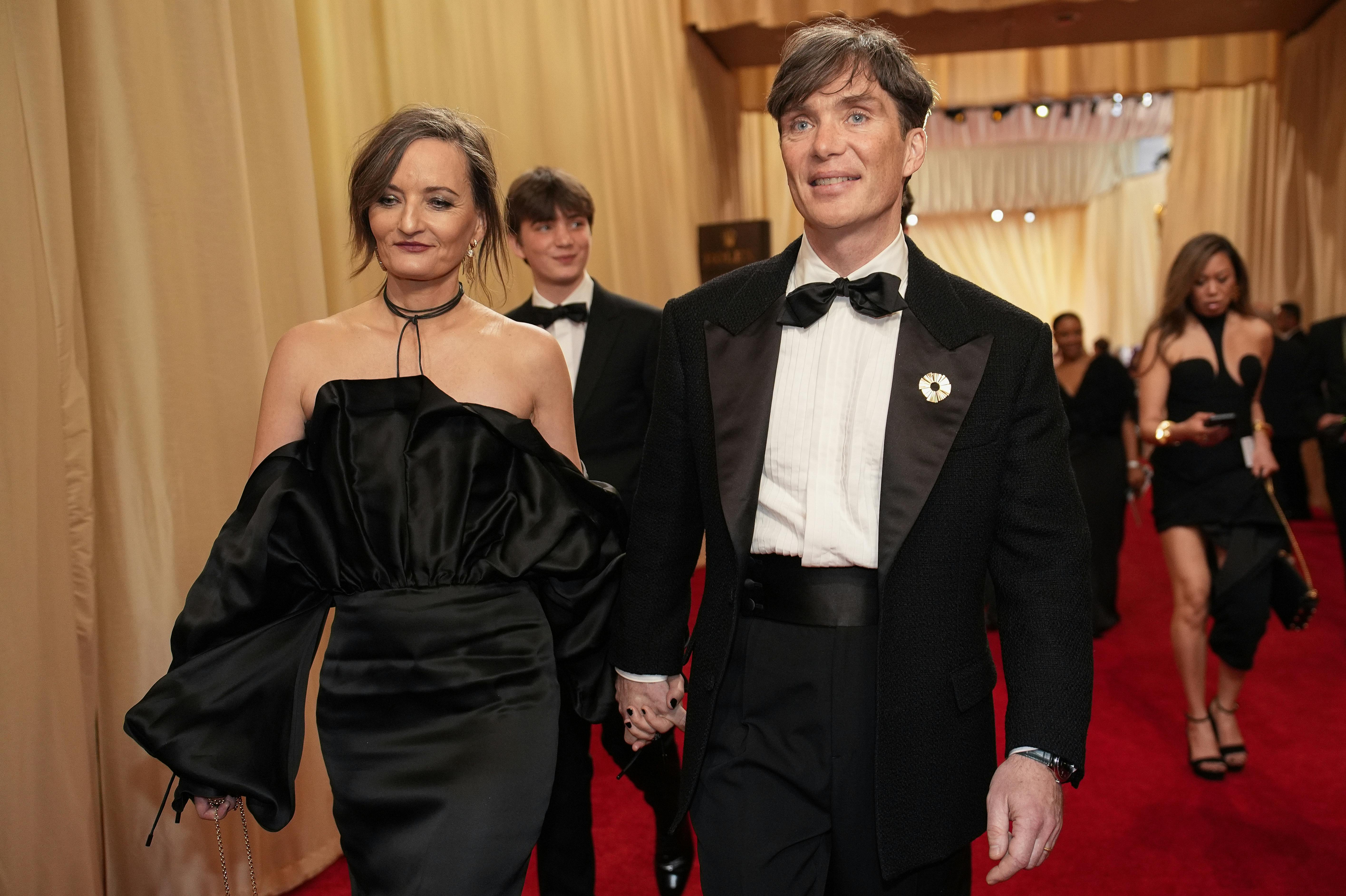Yvonne McGuinness, left, and Cillian Murphy arrive at the Oscars on Sunday, March 10, 2024, at the Dolby Theatre in Los Angeles. (AP Photo/John Locher)