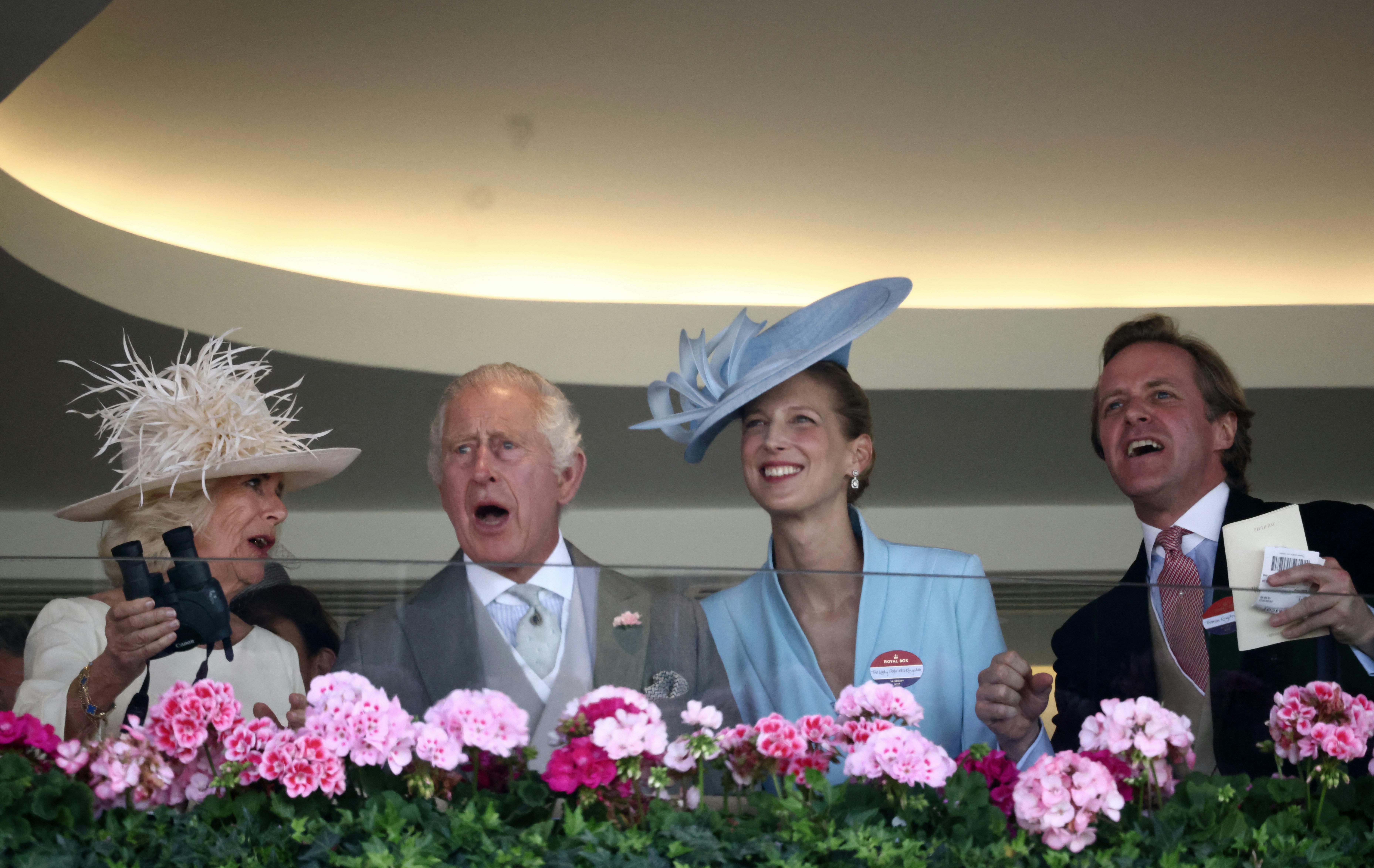 Britain's King Charles III (2L), Britain's Queen Camilla (L), Lady Gabriella Kingston (2R) and Thomas Kingston (R) watch the Wokingham handicap from the Royal Box on the final day of the Royal Ascot horse racing meeting in Ascot, west of London, on June 24, 2023. HENRY NICHOLLS / AFP