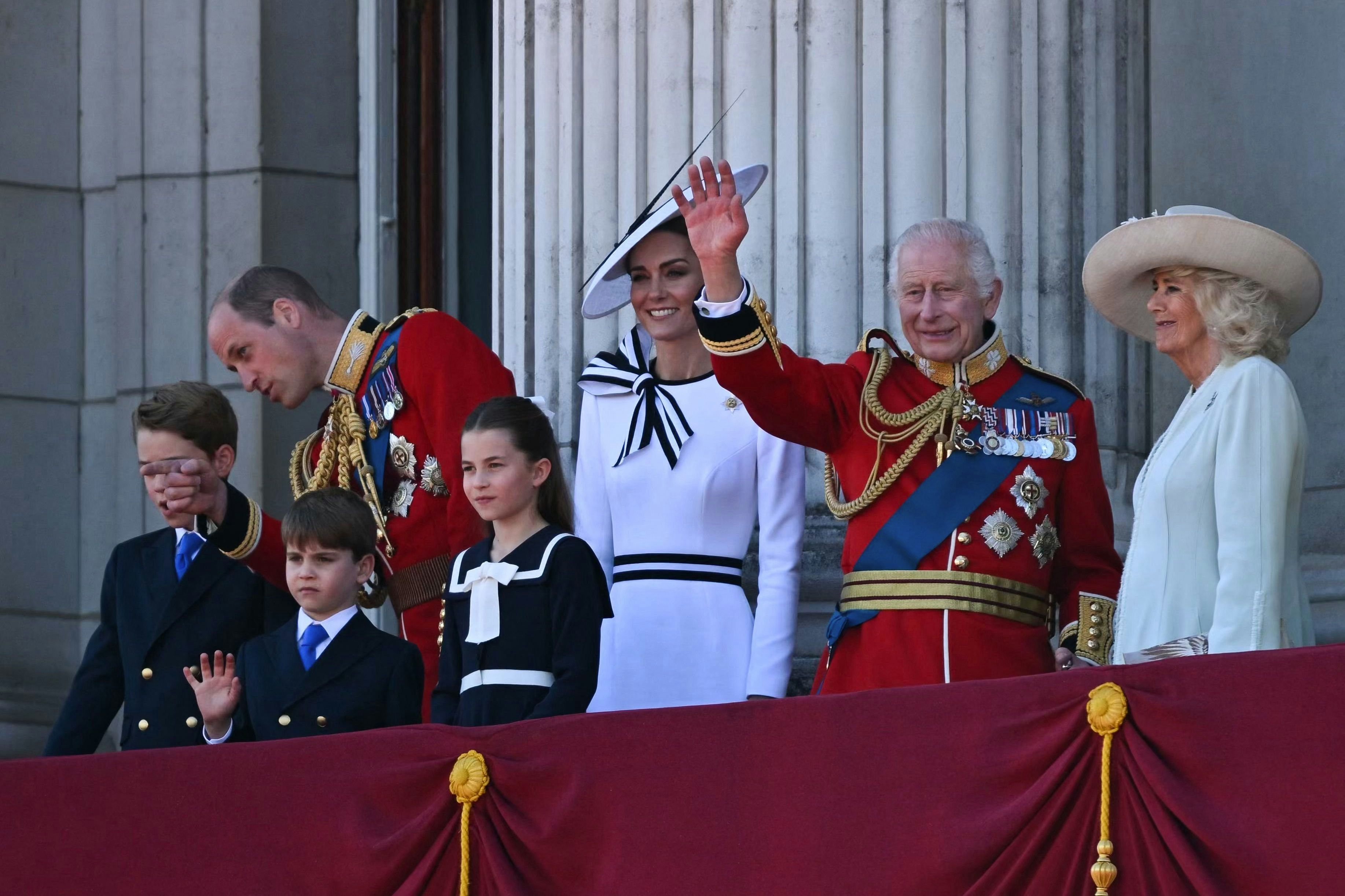 Britain's King Charles III (2R) waves from the balcony of Buckingham Palace after attending the King's Birthday Parade, "Trooping the Colour", in London, on June 15, 2024. The ceremony of Trooping the Colour is believed to have first been performed during the reign of King Charles II. Since 1748, the Trooping of the Colour has marked the official birthday of the British Sovereign. Over 1500 parading soldiers and almost 300 horses take part in the event. (Photo by JUSTIN TALLIS / AFP)