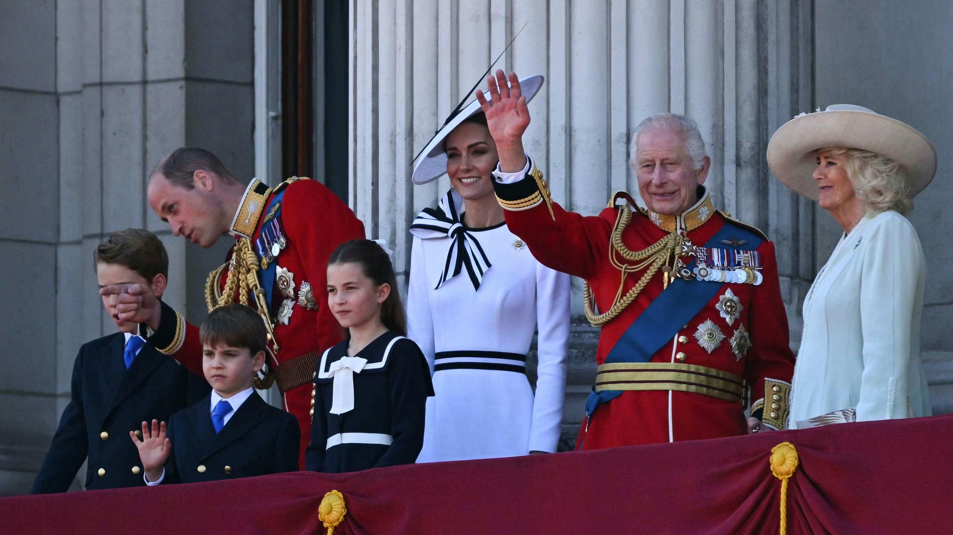 Britain's King Charles III (2R) waves from the balcony of Buckingham Palace after attending the King's Birthday Parade, "Trooping the Colour", in London, on June 15, 2024. The ceremony of Trooping the Colour is believed to have first been performed during the reign of King Charles II. Since 1748, the Trooping of the Colour has marked the official birthday of the British Sovereign. Over 1500 parading soldiers and almost 300 horses take part in the event. (Photo by JUSTIN TALLIS / AFP)
