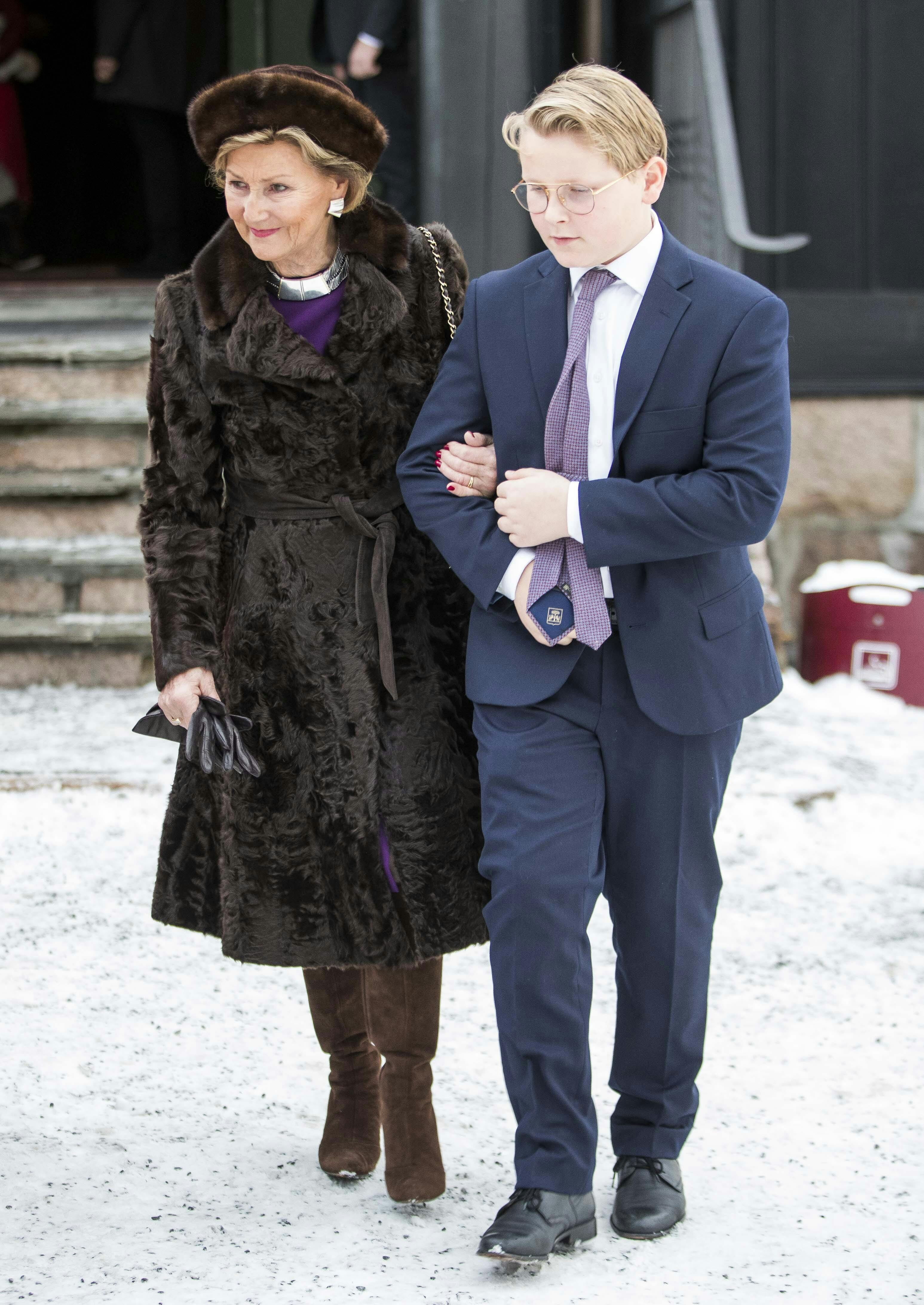 Norway's Queen Sonja (L) and Prince Sverre Magnus (R) leave Holmenkollen chapel after the Christmas Day service on December 25, 2018 in Oslo. (Photo by Terje PEDERSEN / NTB scanpix / AFP) / Norway OUT