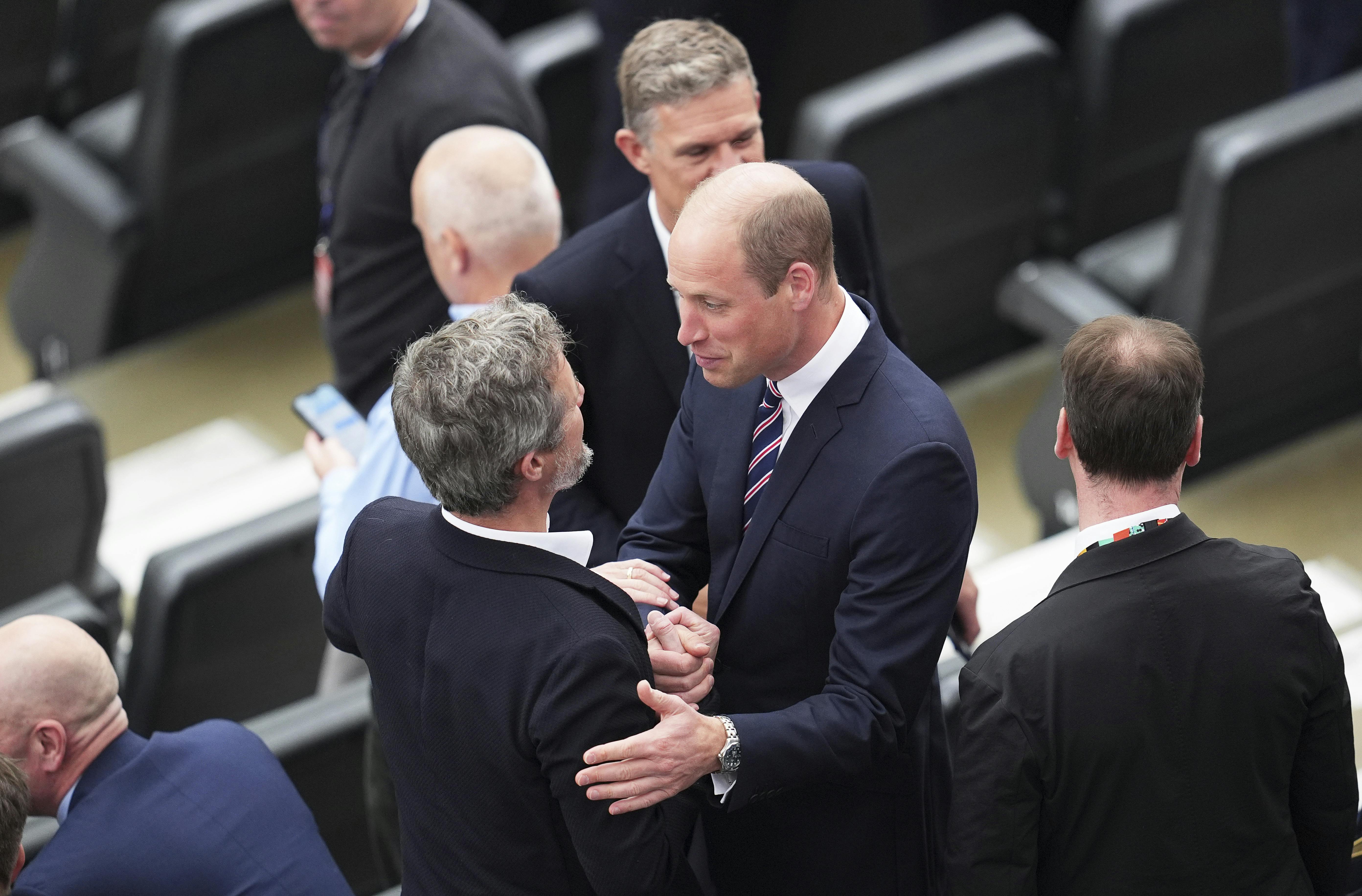 20 June 2024, Hesse, Frankfurt/Main: Soccer, UEFA Euro 2024, European Championship, Denmark - England, preliminary round, Group C, match day 2, Frankfurt Arena, Denmark's King Frederik X. (center l) and William, Prince of Wales, greet each other in the stands before the start of the match. Photo by: Uwe Anspach/picture-alliance/dpa/AP Images