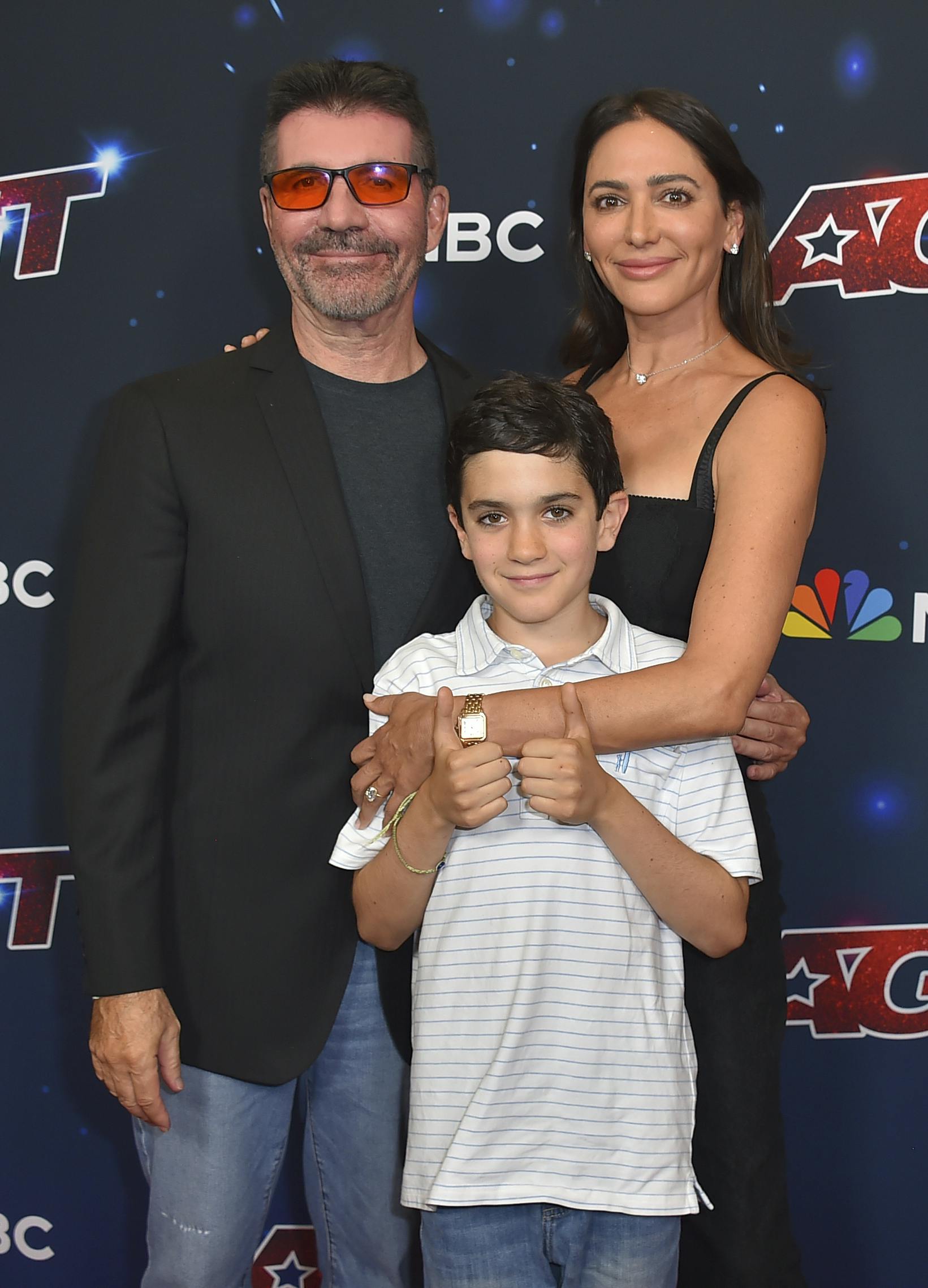 Simon Cowell, from left, Eric Philip Cowell and Lauren Silverman arrive at the "America's Got Talent" Season 18 finale on Wednesday, Sept. 27, 2023, at Hotel Dena in Pasadena, Calif. (Photo by Jordan Strauss/Invision/AP)