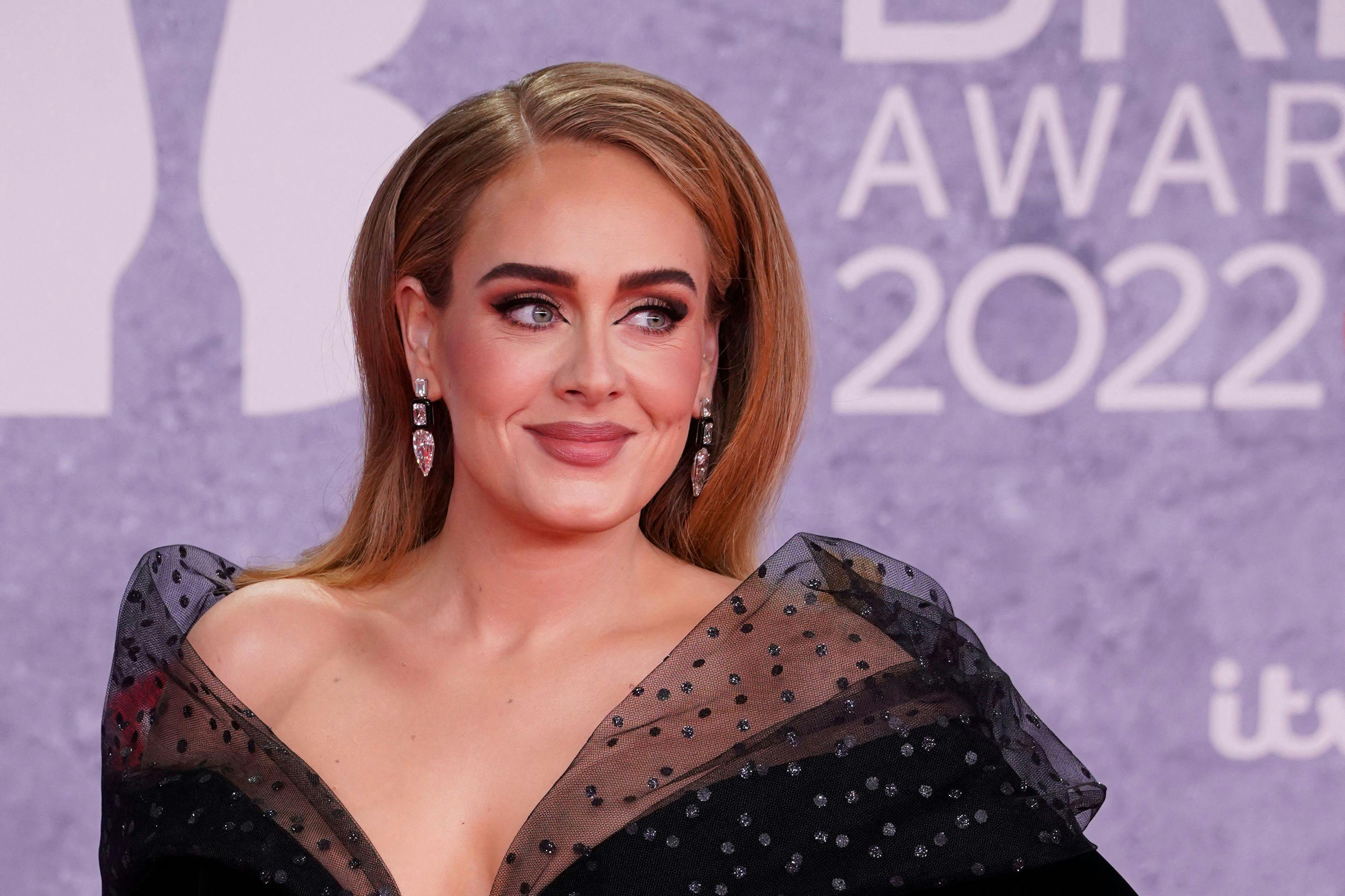 (FILES) In this file photo taken on February 08, 2022 British singer Adele Laurie Blue Adkins aka Adele poses on the red carpet upon her arrival for the BRIT Awards 2022 in London. - The brightest stars in pop music will vie for the industry's top awards at the Grammys in Los Angeles on February 5, 2023, with a Beyonce-Adele rematch set to take center stage. (Photo by Niklas HALLE'N / AFP) / RESTRICTED TO EDITORIAL USE - NO POSTERS - NO MERCHANDISE- NO USE IN PUBLICATIONS DEVOTED TO ARTISTS