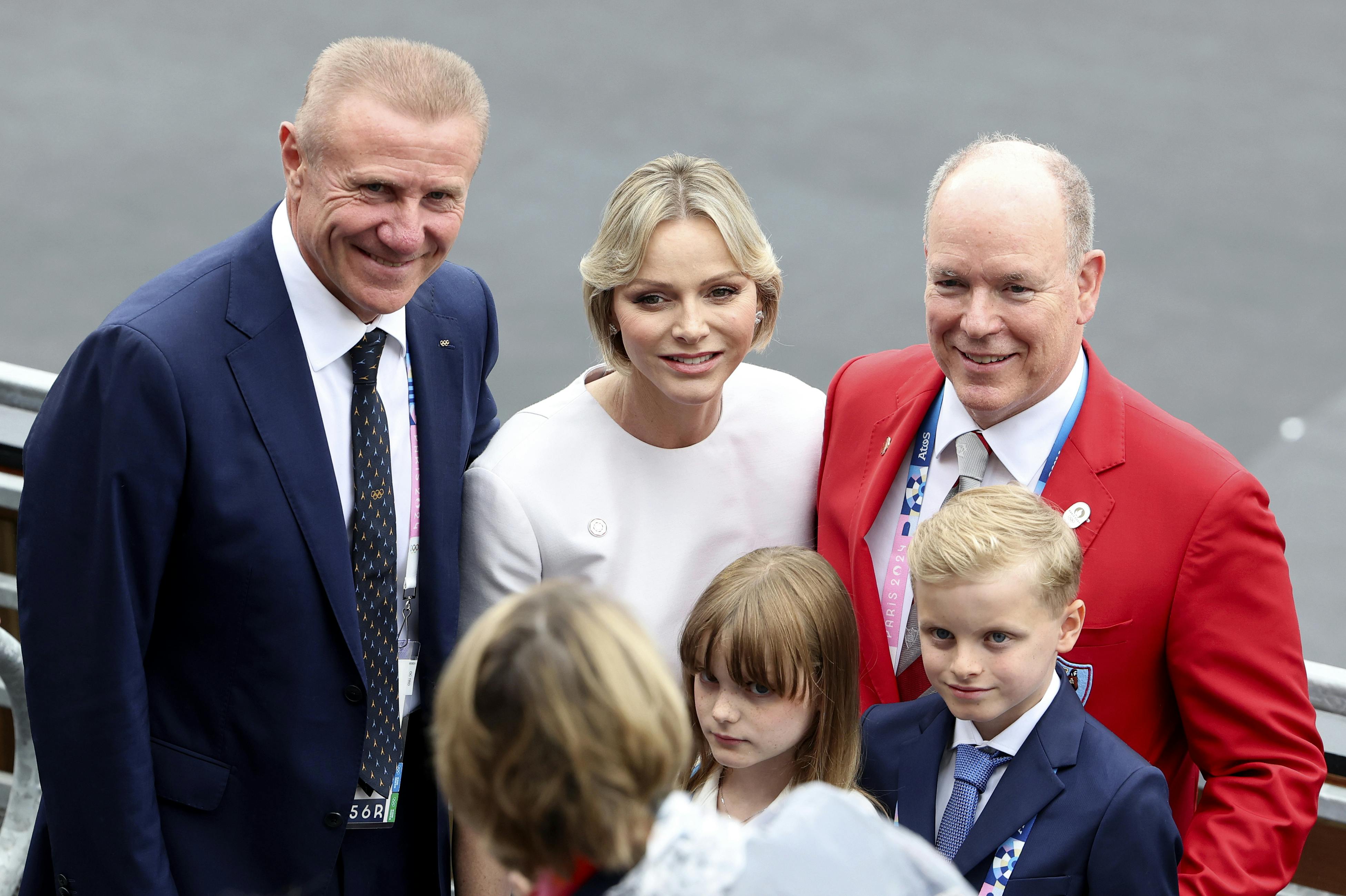 IOC member and former Olympic Pole Vaulter Sergey Bubka, , left, Prince Albert II of Monaco, background right, Princess Charlene of Monaco, center and Princess Gabriella, Prince Jacques attend the red carpet in Paris, France, ahead of the opening ceremony of the 2024 Summer Olympics, Friday, July 26, 2024. (Pascal Le Segretain/Pool Photo via AP)