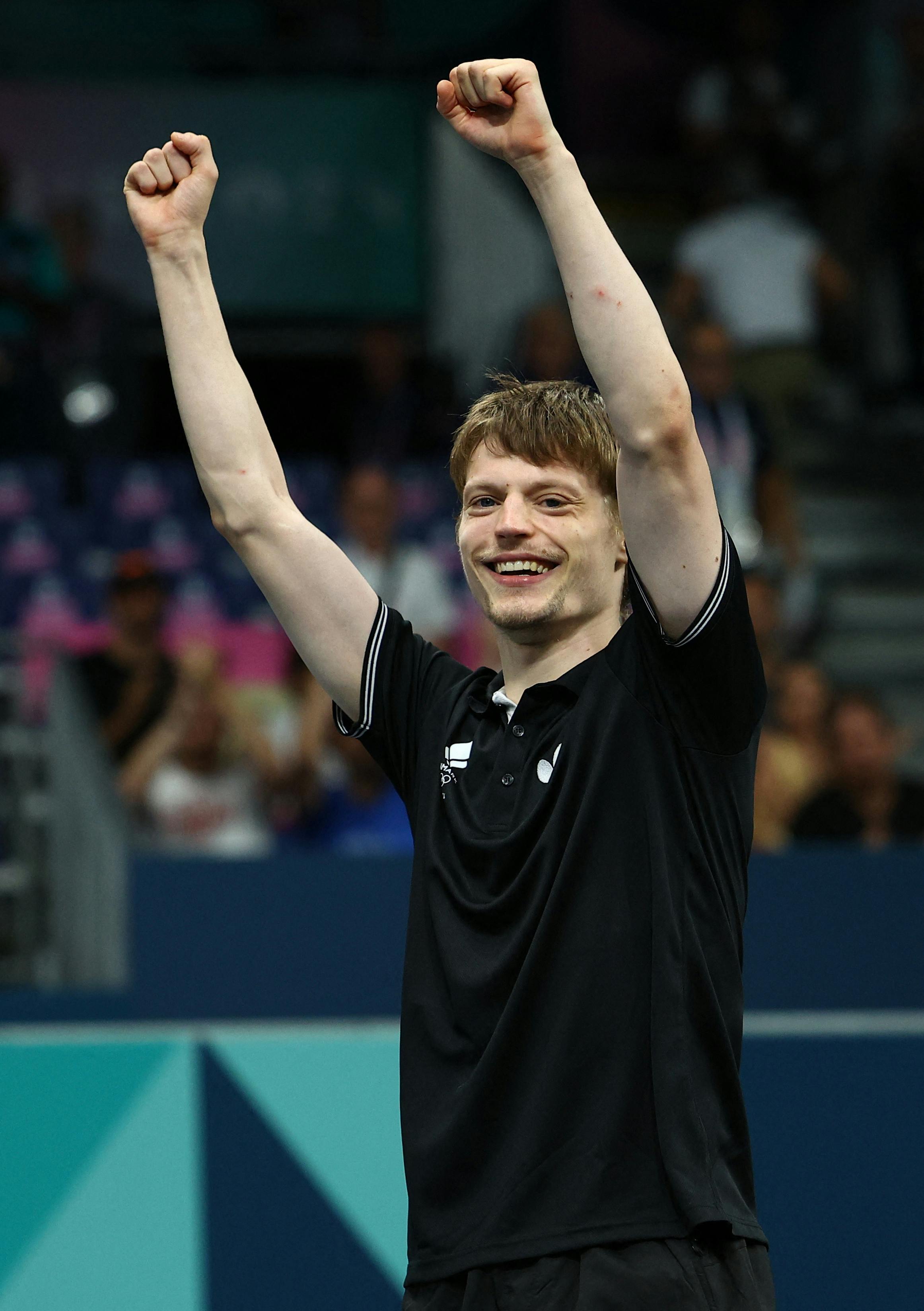 Paris 2024 Olympics - Table Tennis - Men's Singles Round of 64 - South Paris Arena 4, Paris, France - July 29, 2024. Anders Lind of Denmark celebrates after winning his round of 64 match against Marcos Freitas of Portugal. REUTERS/Kim Hong-Ji