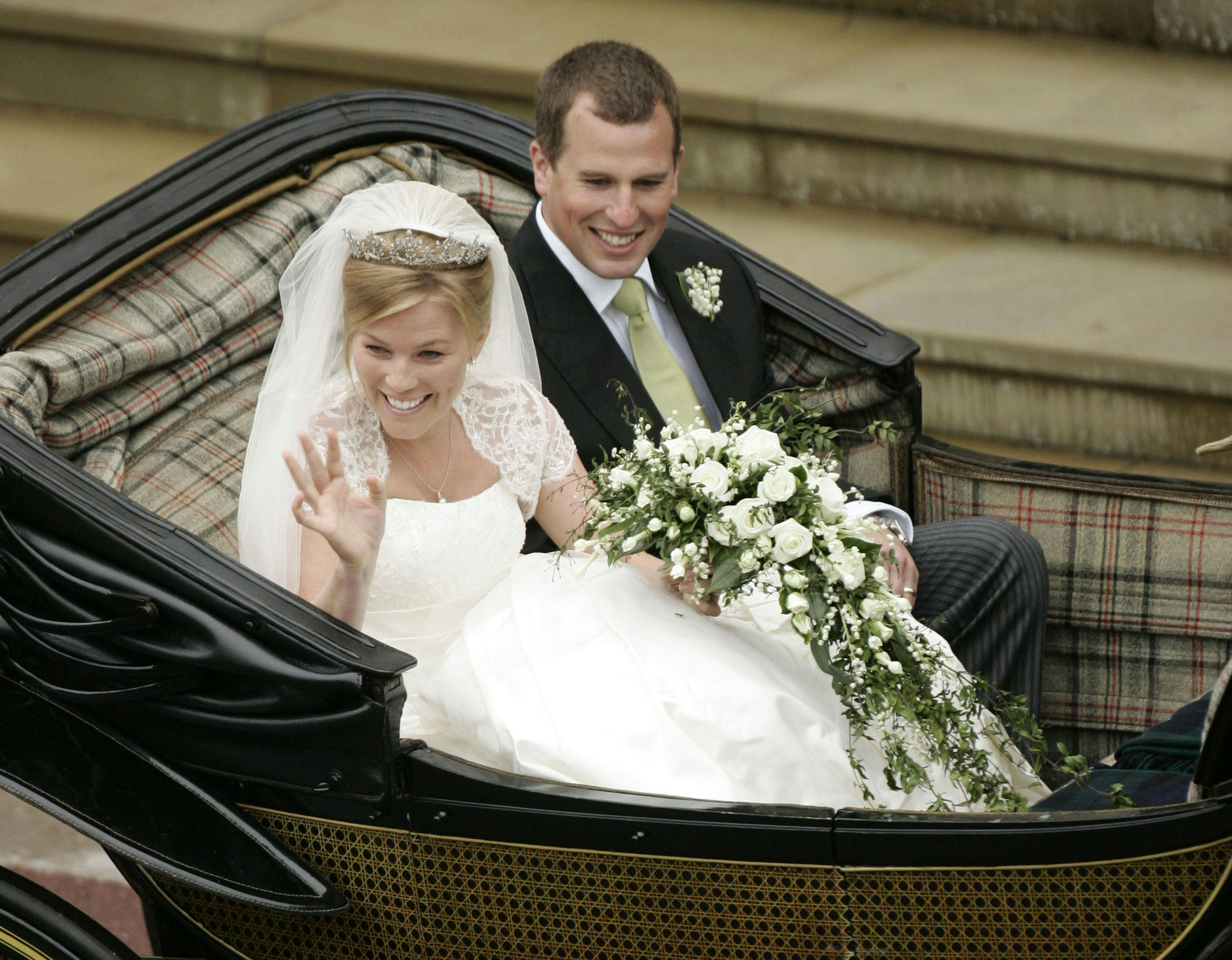 (FILES) In this file photo taken on May 17, 2008, Peter Phillips 30, (L) and Autumn Kelly 31, (R) leave St George's Chapel in Windsor after their marriage vows. - Britain's Queen Elizabeth II's eldest grandson, Peter Phillips, and his wife Autumn have separated and are going to divorce, Buckingham Palace announced, in the latest episode of the hectic saga of the British royal family. (Photo by SANG TAN / POOL / AFP)