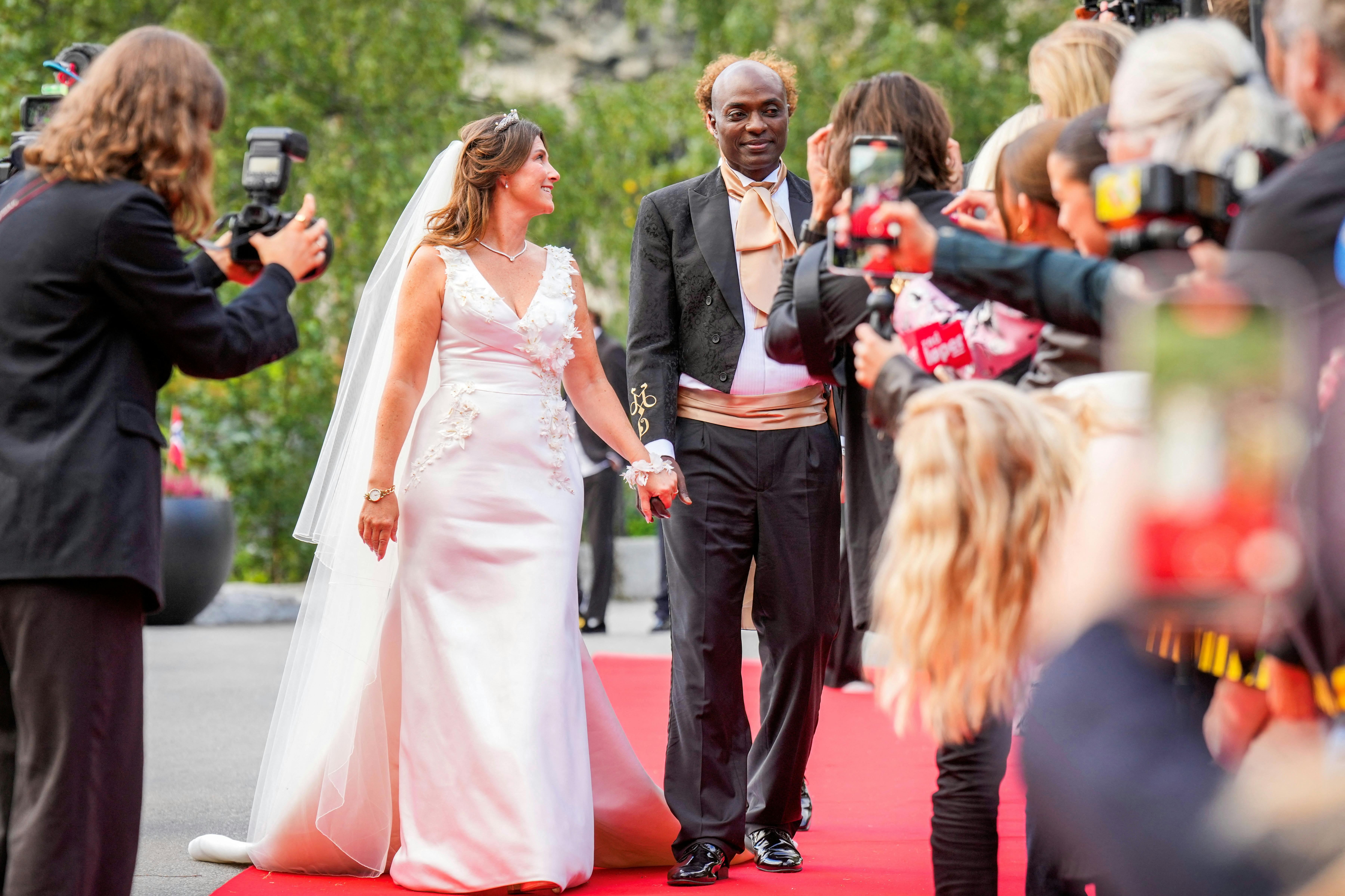 Norway's Princess Martha Louise and Durek Verrett hold hands on the day of their wedding party in Geiranger, Norway August 31, 2024. NTB/Heiko Junge/via REUTERS ATTENTION EDITORS - THIS IMAGE WAS PROVIDED BY A THIRD PARTY. NORWAY OUT.NO COMMERCIAL OR EDITORIAL SALES IN NORWAY.