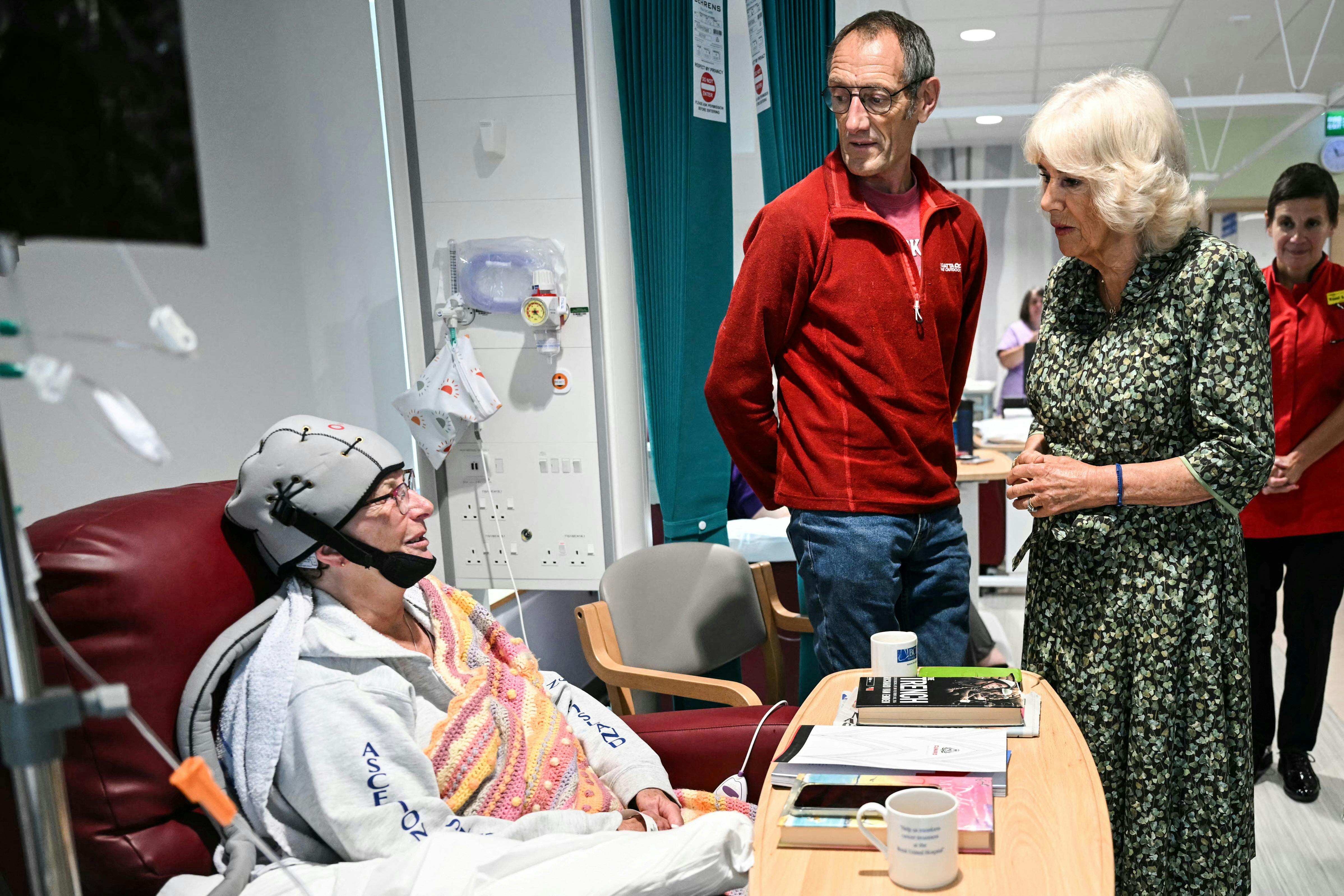 Britain's Queen Camilla speaks with a cancer patient, as she visits the Dyson Cancer Centre, at the Royal United Hospitals Bath NHS Foundation Trust, in Bath, Britain September 3, 2024. JUSTIN TALLIS/Pool via REUTERS