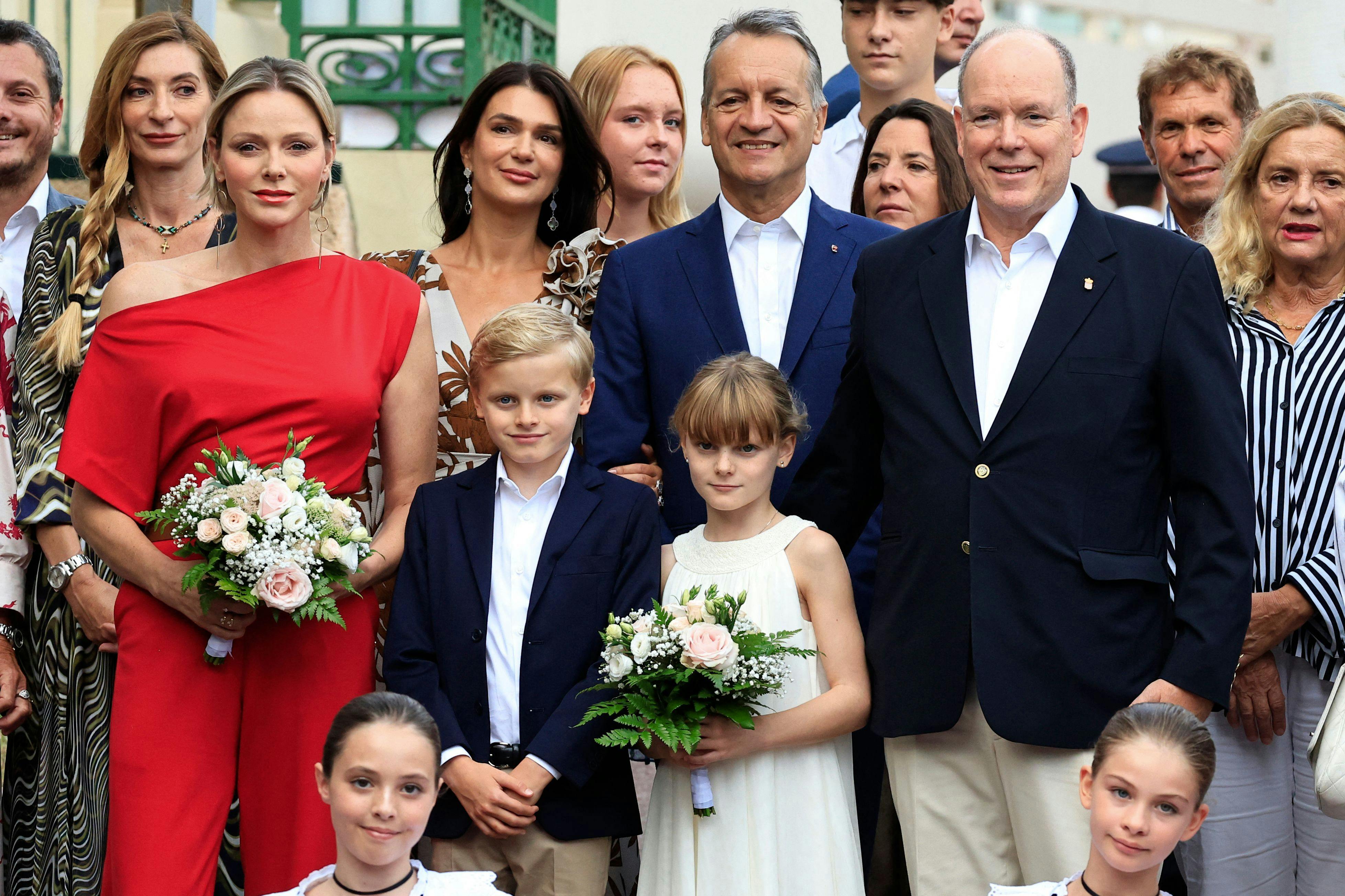 Prince Albert II (R) and his wife Princess Charlene of Monaco (L) attend with their twins Prince Jacques (C-L) and Princess Gabriella (C-R) the traditional "Pique Nique Monegasque" (Picnic), in The Principality of Monaco on September 7, 2024. (Photo by Valery HACHE / AFP)