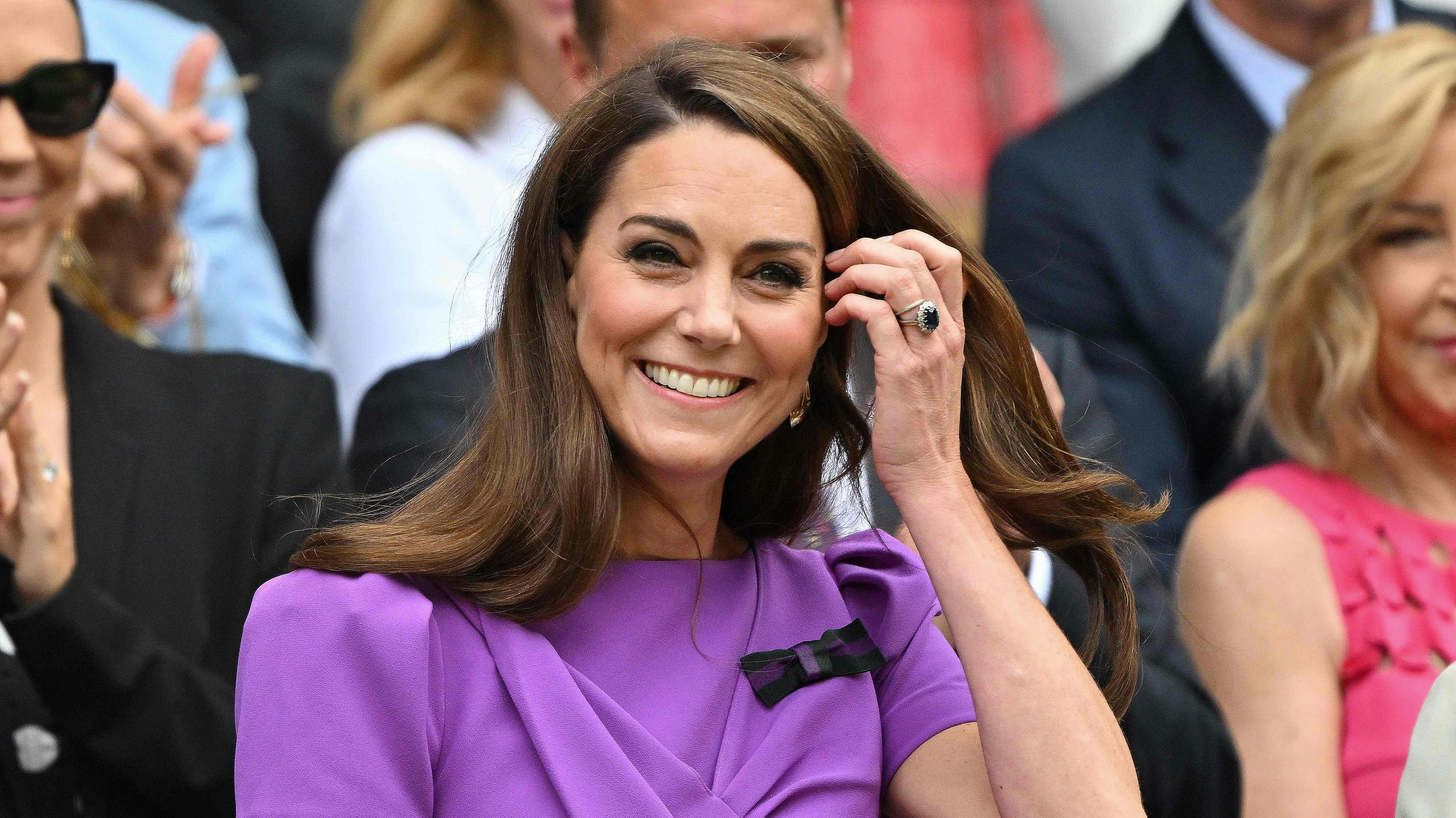 TOPSHOT - Britain's Catherine, Princess of Wales reacts as she arrives in the Royal Box on Centre Court to attend the men's singles final tennis match on the fourteenth day of the 2024 Wimbledon Championships at The All England Lawn Tennis and Croquet Club in Wimbledon, southwest London, on July 14, 2024. (Photo by ANDREJ ISAKOVIC / AFP) / RESTRICTED TO EDITORIAL USE