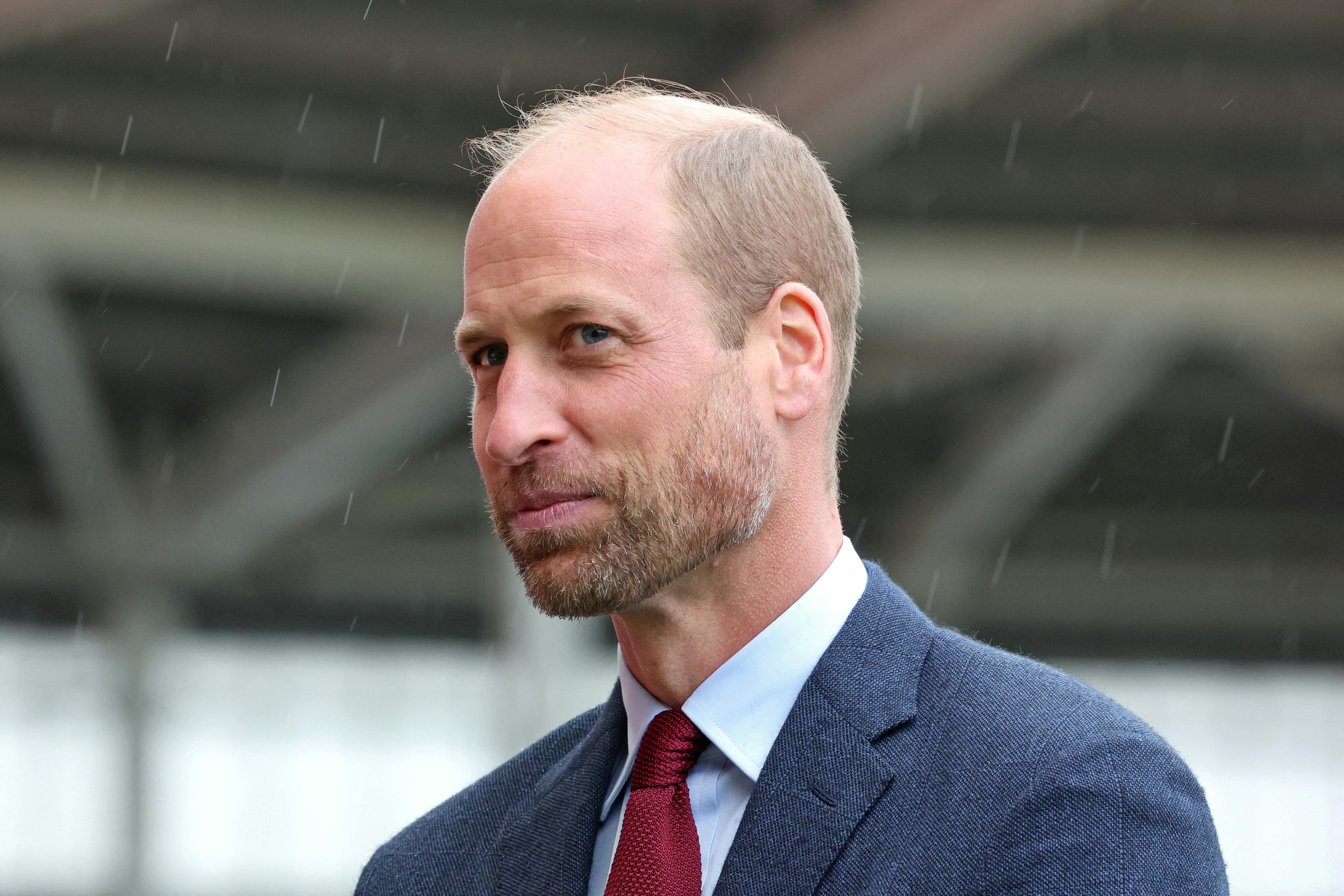 Prince William, Prince of Wales smiles as it begins to rain during a visit to Parc y Scarlets, the home of the Scarlets Rugby Union team in Llanelli, Wales, Britain, September 10, 2024. Chris Jackson/Pool via REUTERS