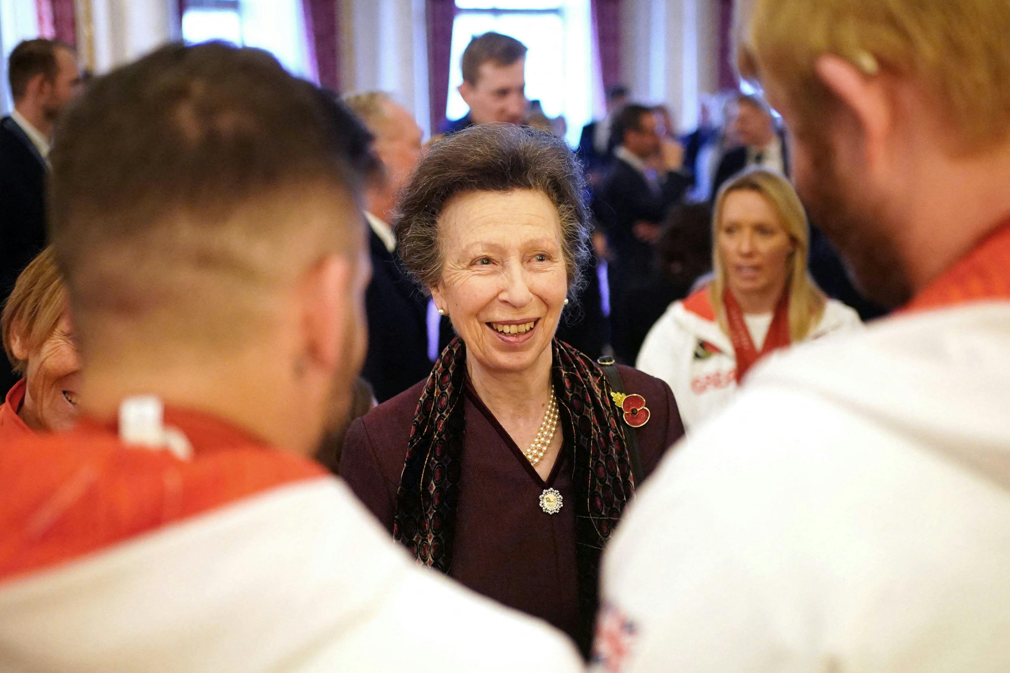 Britain's Princess Anne, Princess Royal (C) speaks with guests during a reception for medallists from the Paris 2024 Olympic and Paralympic Games at Buckingham Palace in London on November 7, 2024. (Photo by Yui Mok / POOL / AFP)