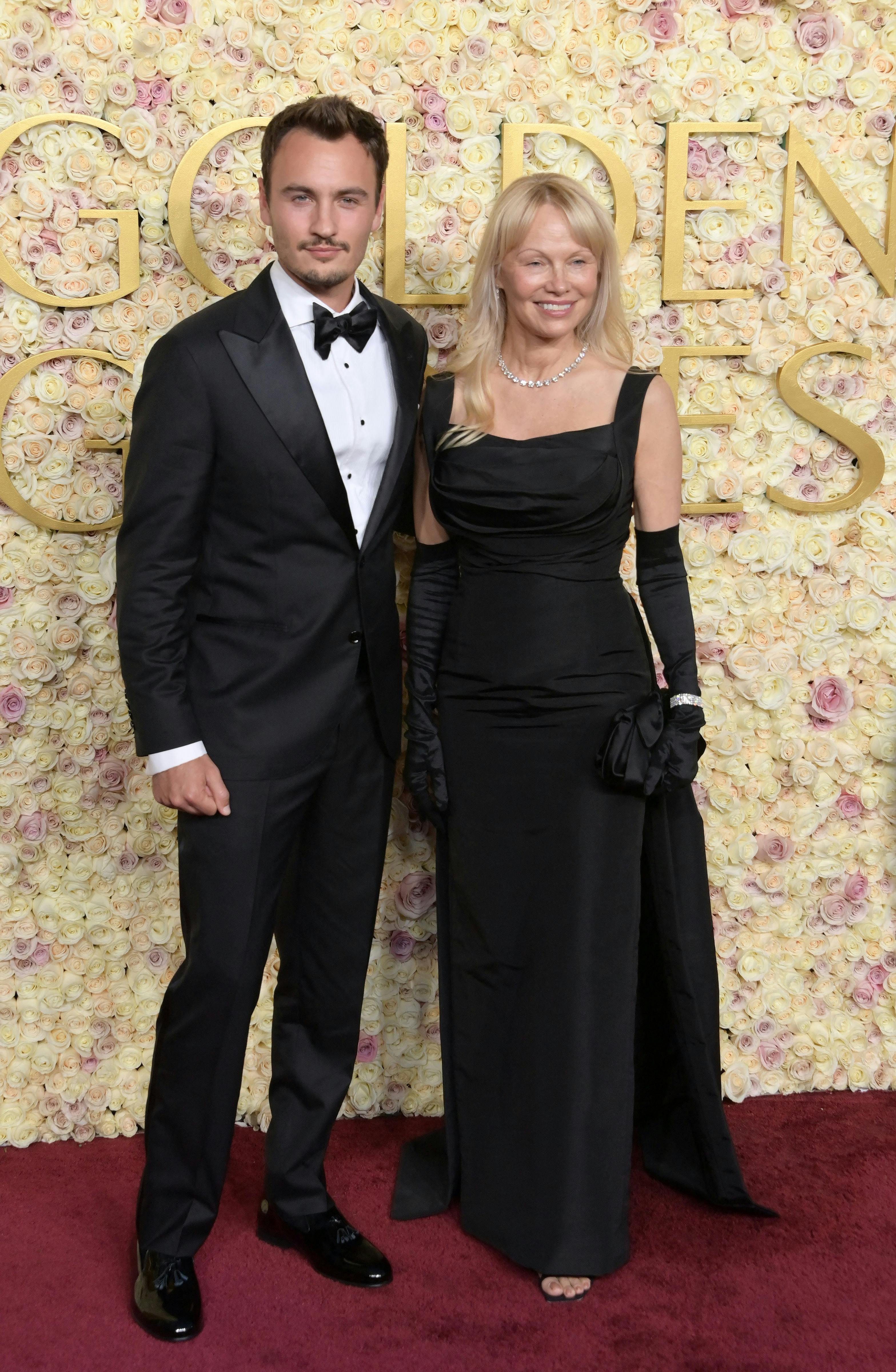 82nd Annual Golden Globe Awards - Arrivals. 05 Jan 2025 Pictured: Brandon Thomas Lee and Pamela Anderson. Photo credit: OConnor-Arroyo/AFF-USA.com / MEGA TheMegaAgency.com sales@mega.global (Mega Agency TagID: MEGA1250849_001.jpg) [Photo via Mega Agency]