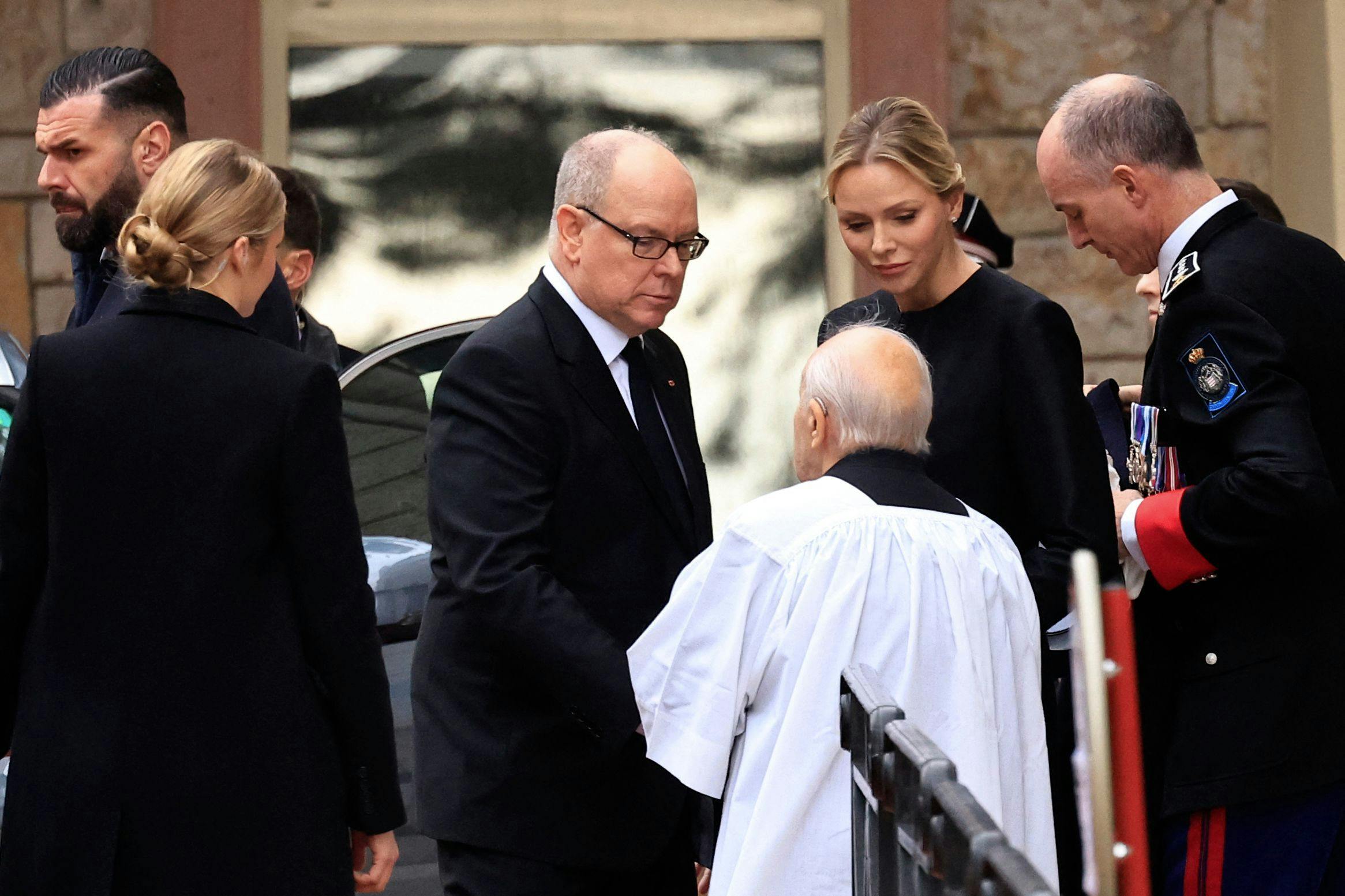 Prince Albert II (Centre L) and Princess Charlene of Monaco (centre R) leave after attending the funeral of Guillaume Didier, former French minister and head of the Monegasque government, in Monaco on January 23, 2025. (Photo by Valery HACHE / AFP) / / NO TABLOIDS WEB & PRINT, NO DAILY MAIL, NO DAILY MAIL GROUP, NO VOICI, NO CLOSER /