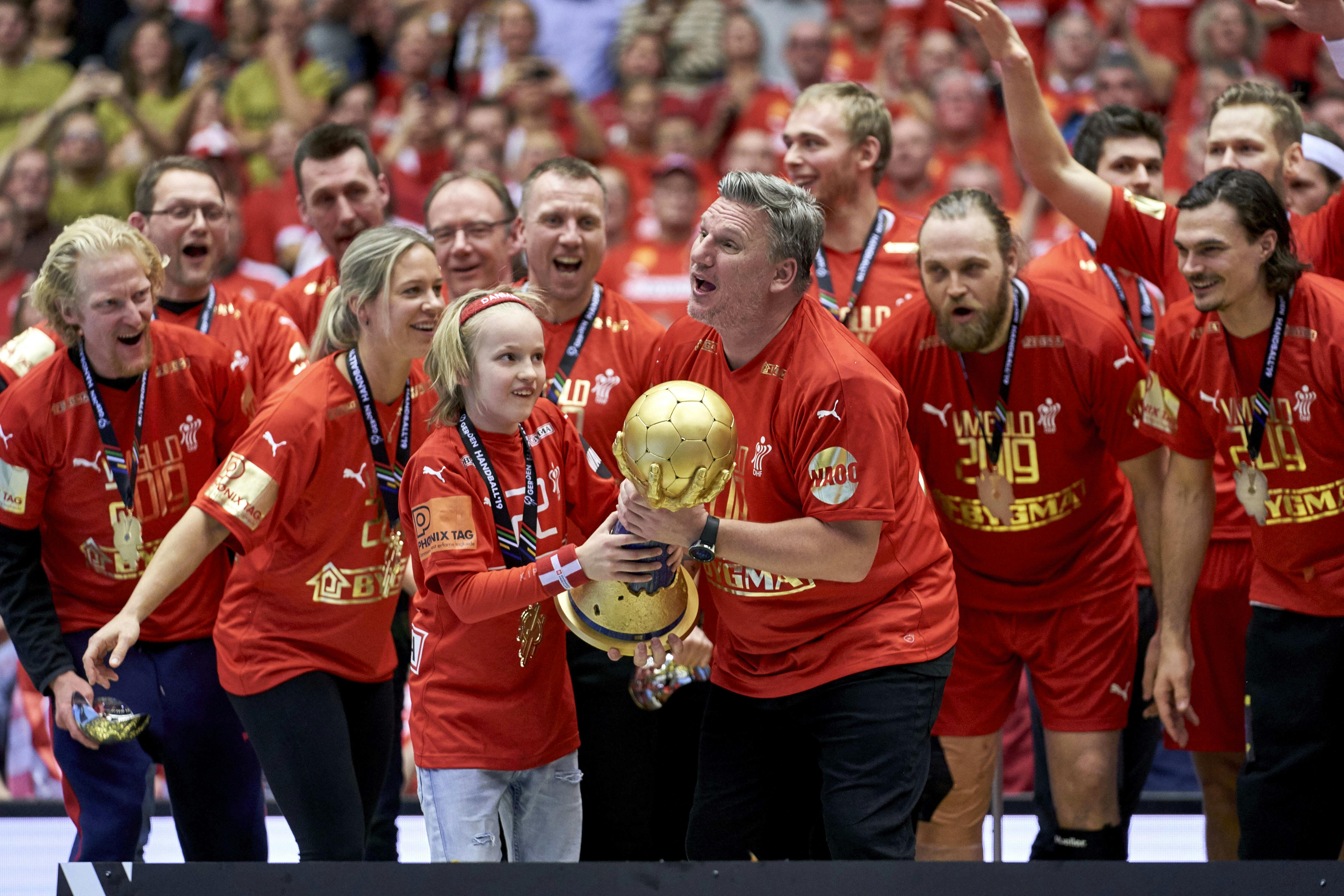 Nikolaj Jacobsen (B) Coach of Denmark with his son Linus with the trophy and gold medal after the men"s IHF Handball World Championship Final between Denmark and Noway at the Jyske Bank Boxen arena in Herning Denmark on Sunday January 27 2019.