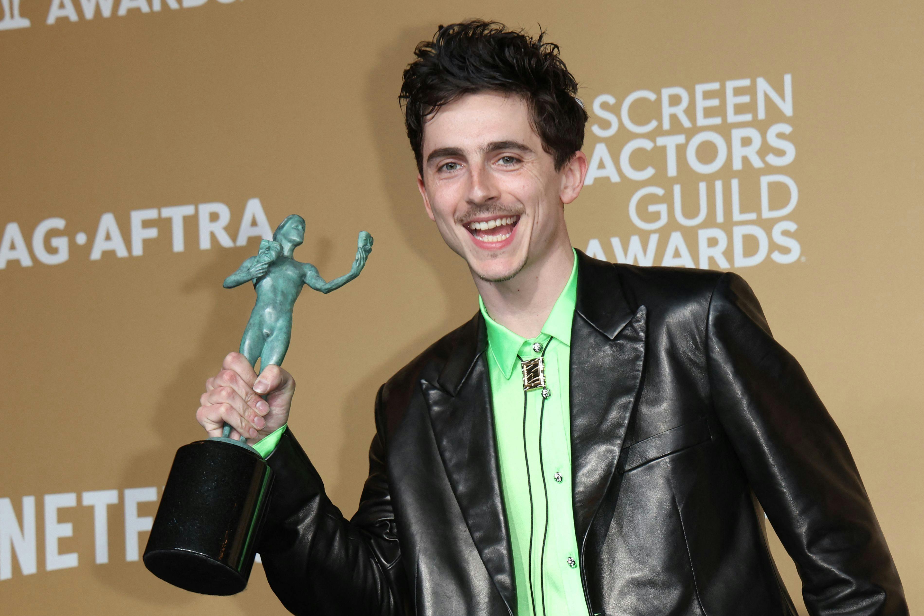 TOPSHOT - US-French actor Timothee Chalamet poses in the press room with the award for Outstanding Performance by a Male Actor in a Leading Role in a Motion Picture for "A Complete Unknown" during the 31st Annual Screen Actors Guild awards at the Shrine Auditorium in Los Angeles, February 23, 2025. (Photo by VALERIE MACON / AFP)