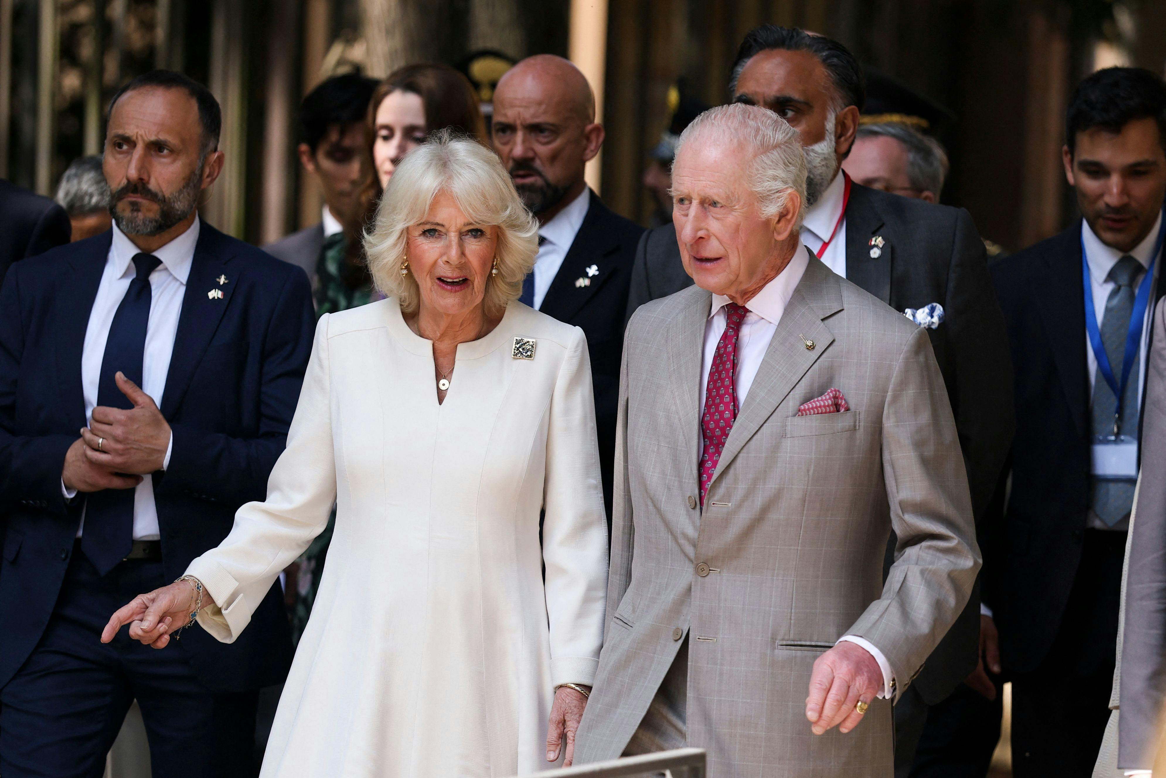 Britain's King Charles and Queen Camilla walk in Ravenna, on the last day of their state visit to Italy, on April 10, 2025. (Photo by Phil Noble / POOL / AFP)