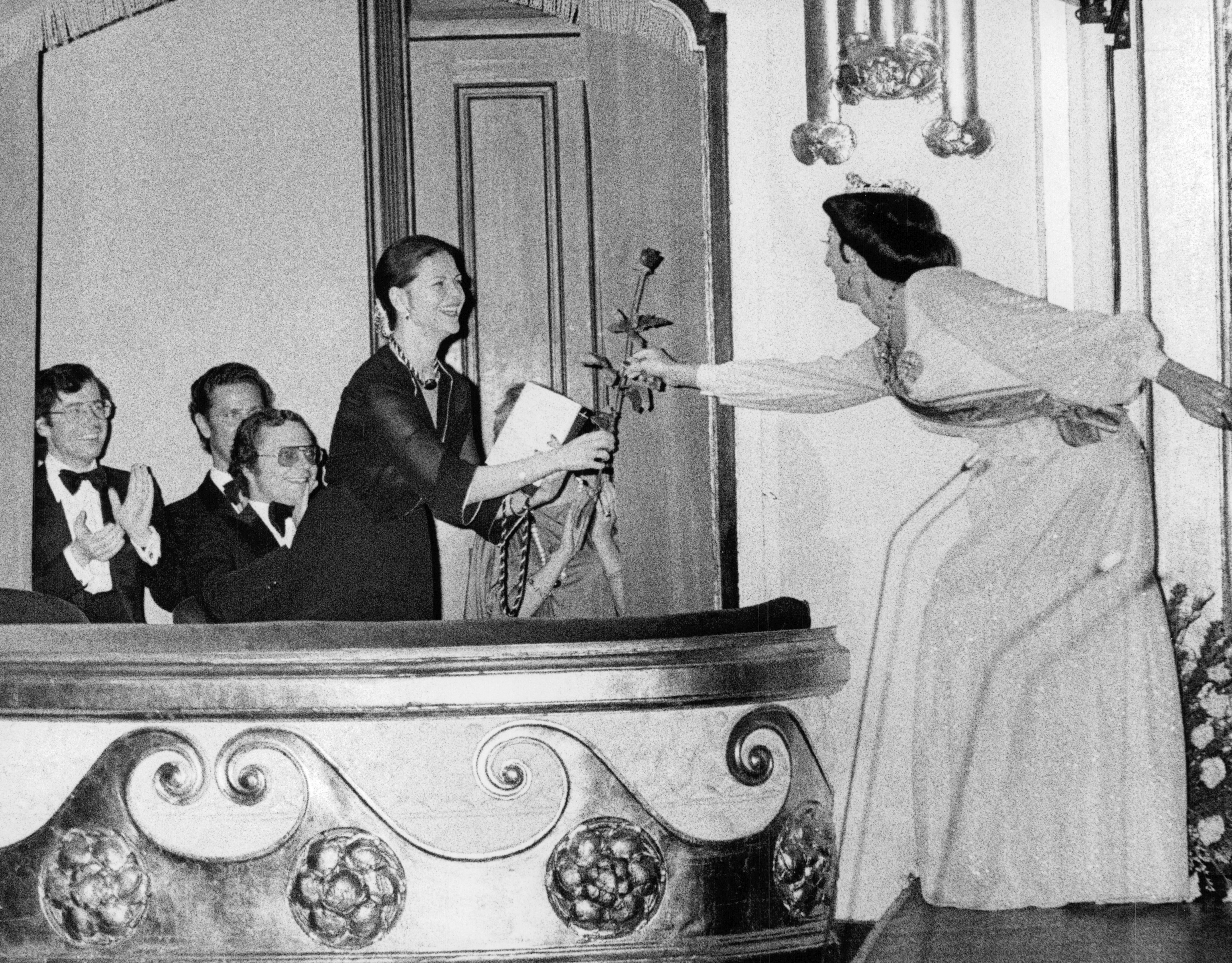 Jubilation in the royal box when drag show artist Christer Lindarw hands over arose to Queen Silvia after inpersonating her on stage for the first time. Stockholm, Sweden 28 November 1977 Photo: Kent Östlund SvD / TT / code 12014