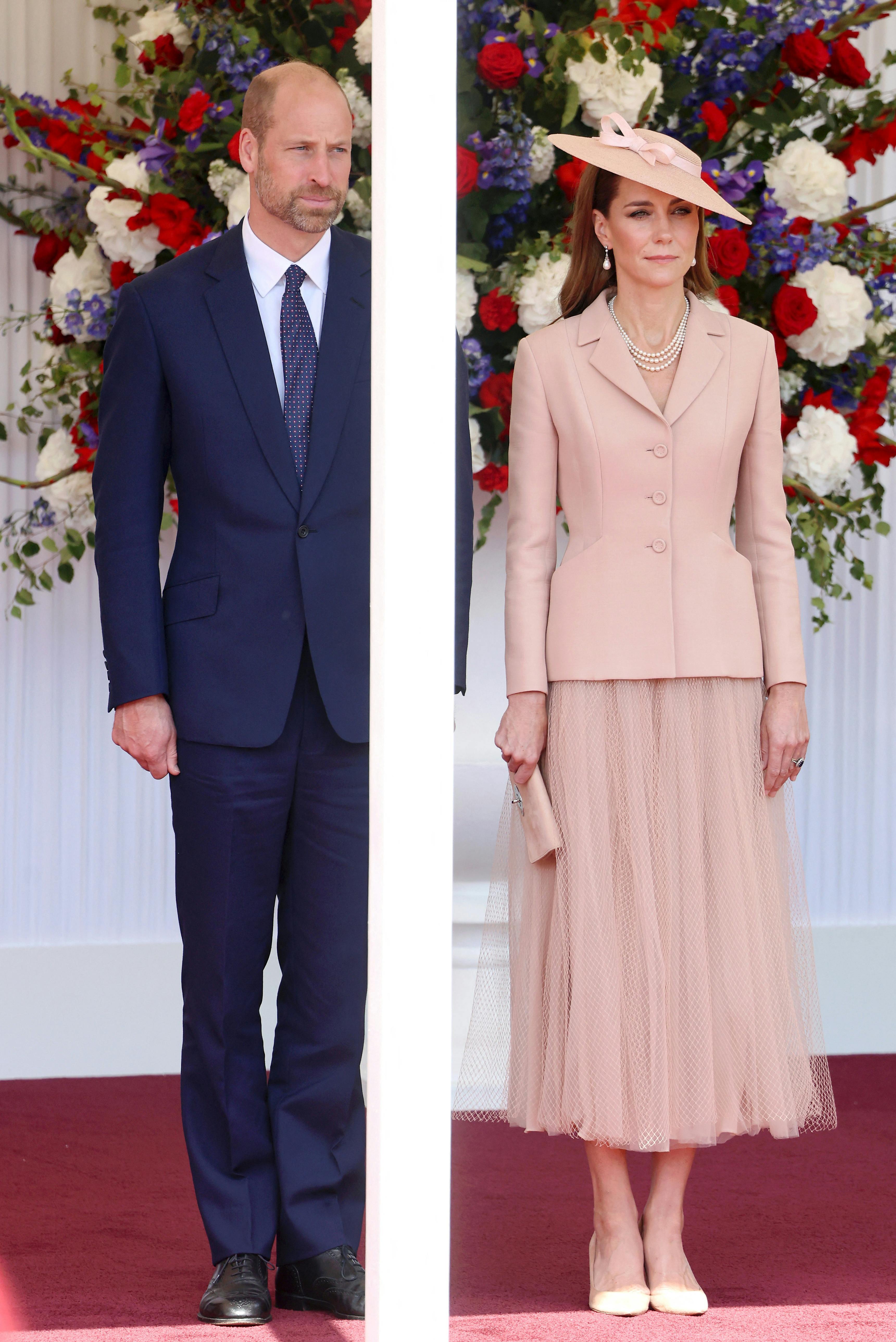 WINDSOR, ENGLAND - JULY 08: Prince William, Prince of Wales and Catherine, Princess of Wales stand on the day of the state visit by French President Emmanuel Macron and his wife, Brigitte Macron, on July 08, 2025 in Windsor, England. Chris Jackson/Pool via REUTERS