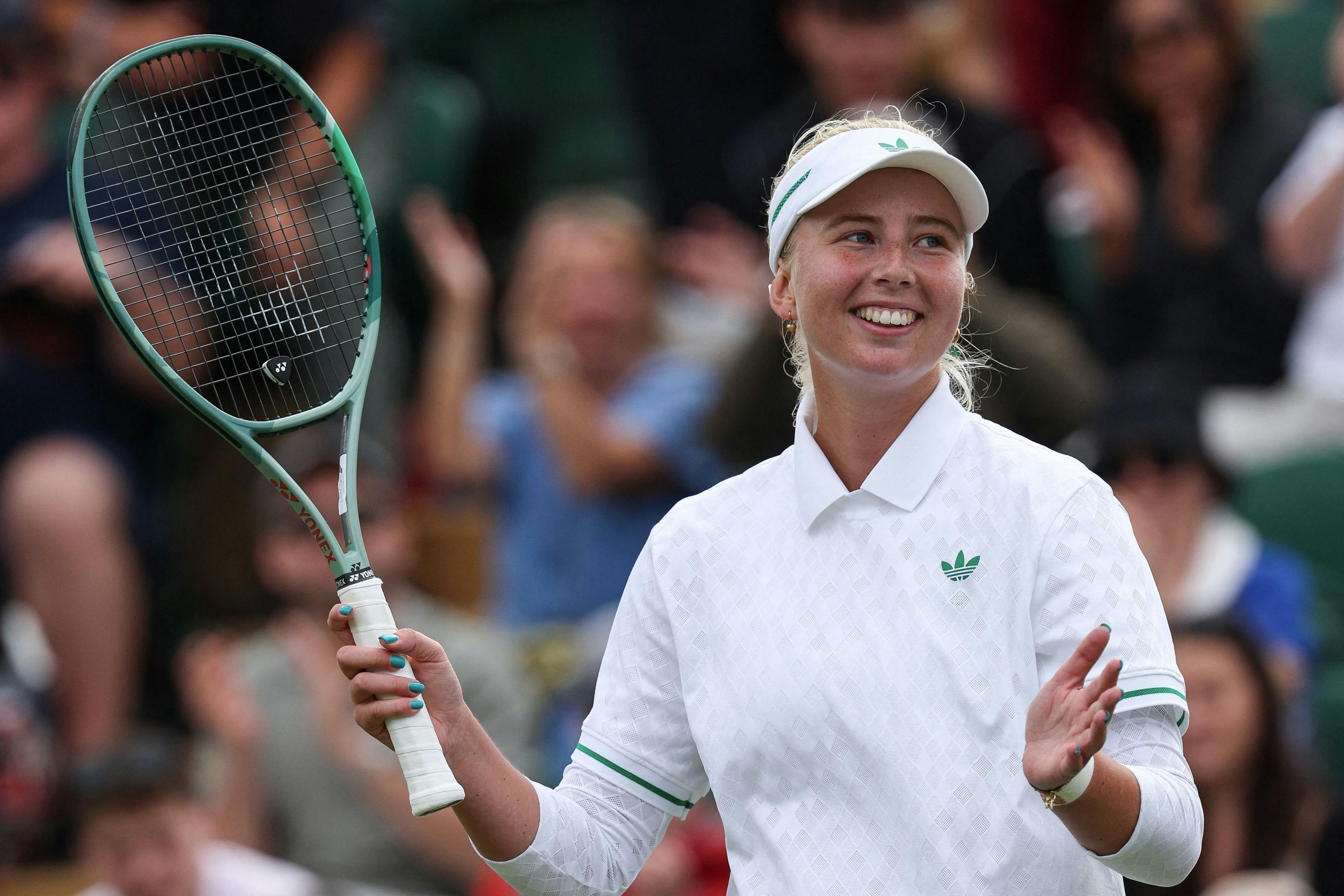 Denmark's Clara Tauson celebrates after victory over Kazakhstan's Elena Rybakina at the end of their women's singles third round tennis match on the sixth day of the 2025 Wimbledon Championships at The All England Lawn Tennis and Croquet Club in Wimbledon, southwest London, on July 5, 2025. (Photo by Adrian Dennis / AFP) / RESTRICTED TO EDITORIAL USE