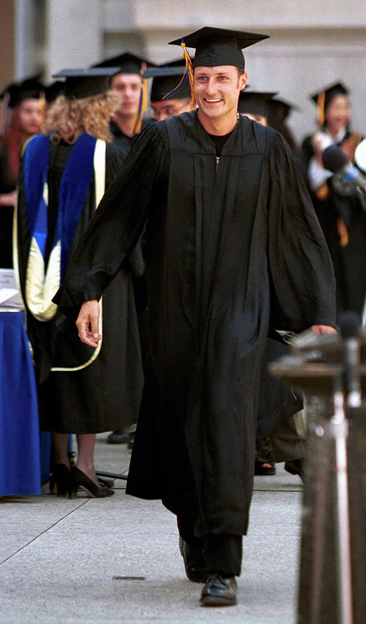 Crown Prince Haakon Magnus of Norway walks across stage to receive his undergraduate diploma in Political Science from the University of California at Berkeley, during the university's 1999 Commencement 24 May, 1999.