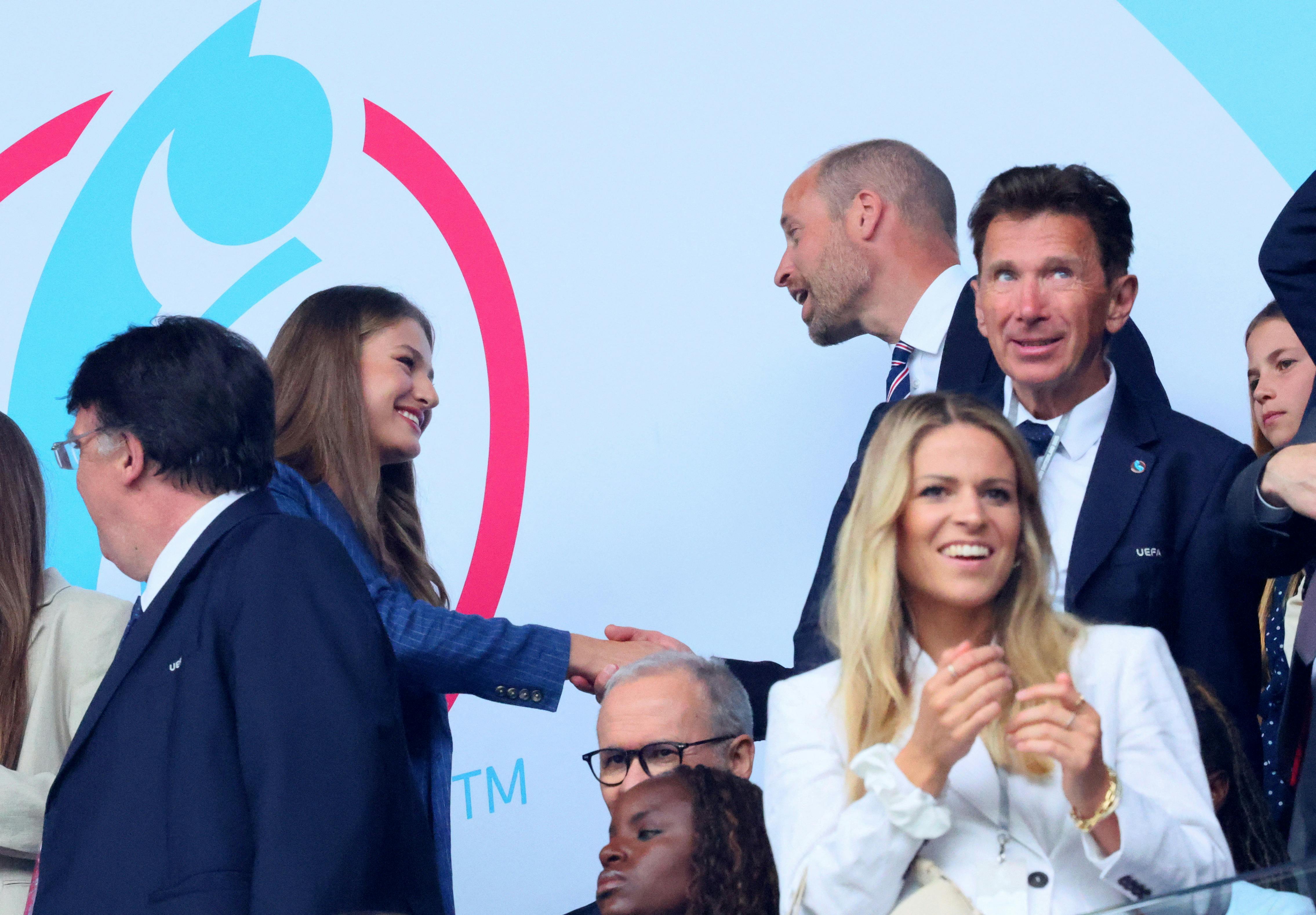Soccer Football - UEFA Women's Euro 2025 - Final - England v Spain - St. Jakob-Park, Basel, Switzerland - July 27, 2025 Leonor, Princess of Asturias shakes hands with Britain's Prince William in the stands before the match REUTERS/Denis Balibouse