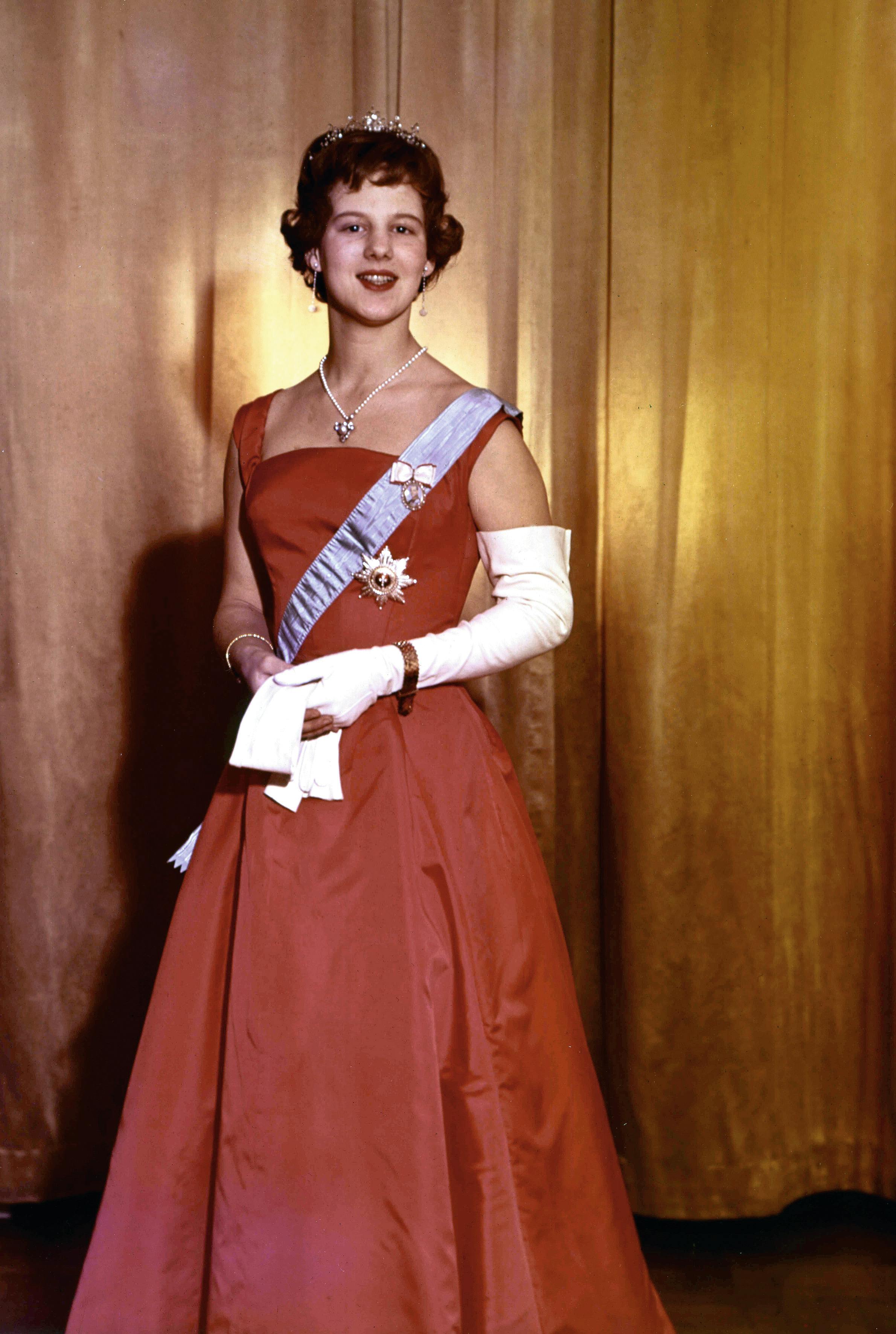 QUEEN MARGRETHE 70 YEARS BIRTHDAY - Queen Margrethe 18 years old - Tronfølger Margrethe på sin 18-års fødselsdag i rød kjole. Tronfølgeren bærer et spidsbuede diadem, som hun senere forærede Alexandra i forbindelse med brylluppet med prins Joachim. - Date: Archive photo 1958 -  Photo: Elfelt/All Over Press Denmark  
