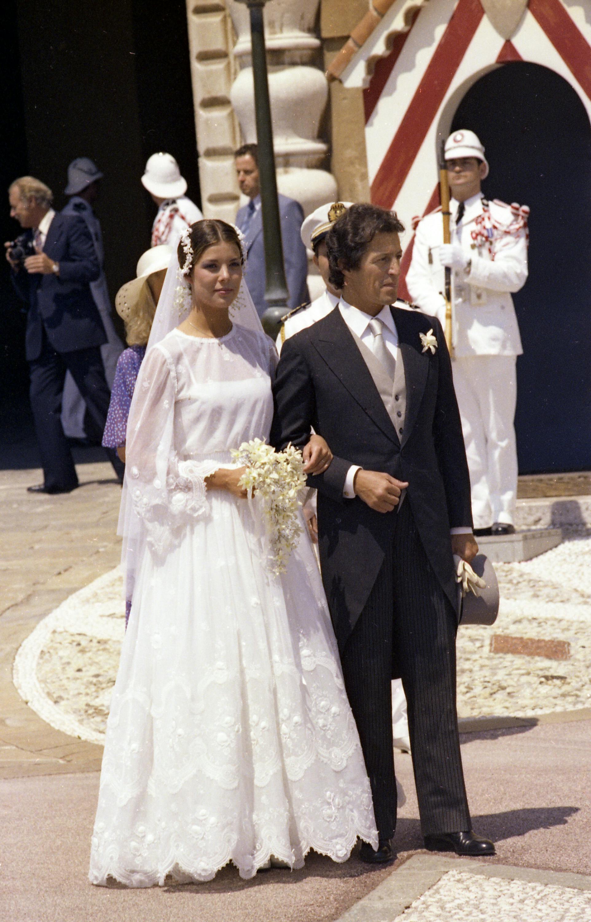 Princess Caroline of Monaco stands with her husband Philippe Junot at the entrance of the Monaco Palace after their church wedding in Monaco, June 29, 1978. (AP Photo/Stf)