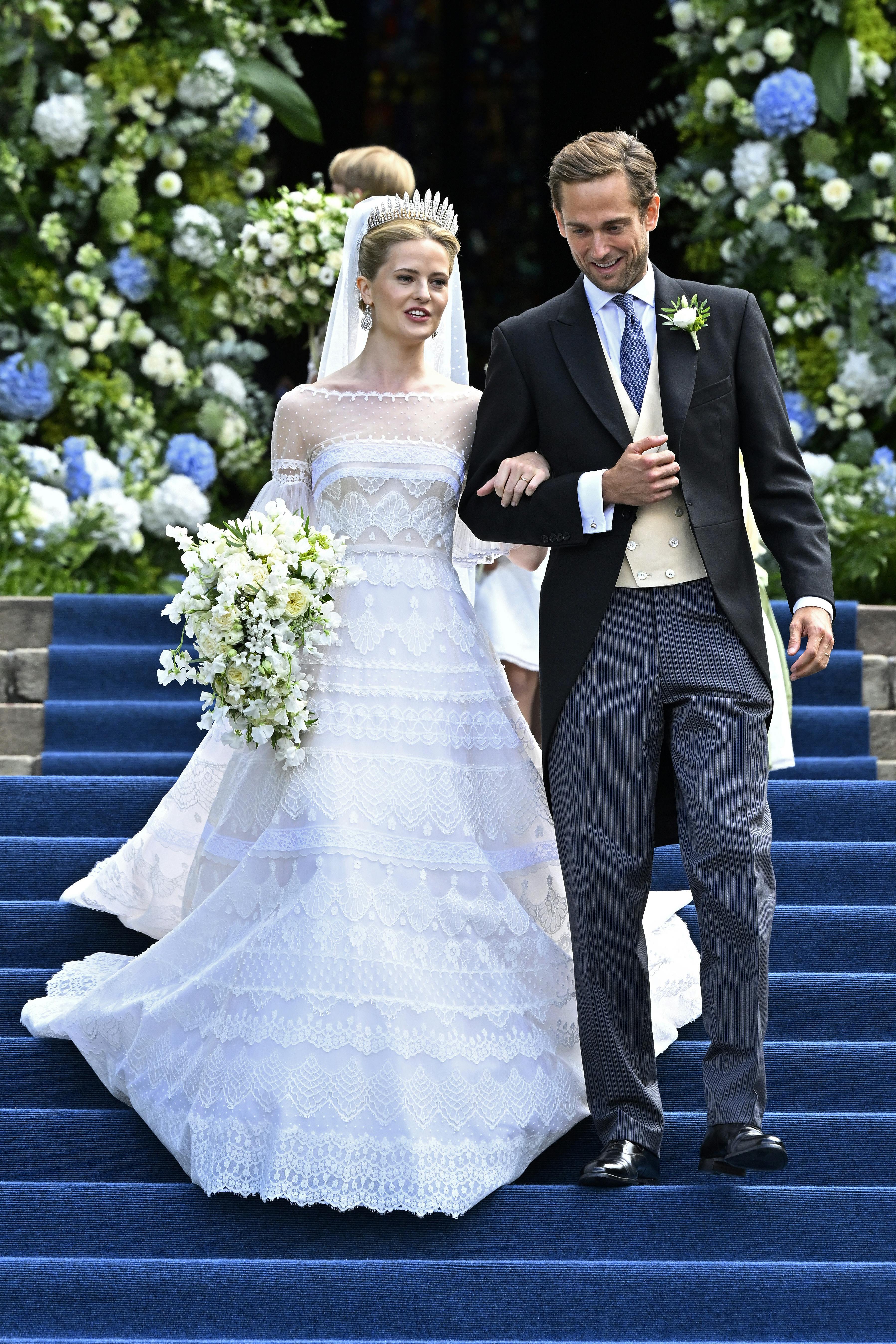 Princess Marie Caroline of Liechtenstein and Leopoldo Maduro Vollmer come out of the church after their wedding ceremony at Cathedral St. Florin in Vaduz, Liechtenstein, Saturday, Aug. 30, 2025. (Walter Bieri/Keystone via AP)