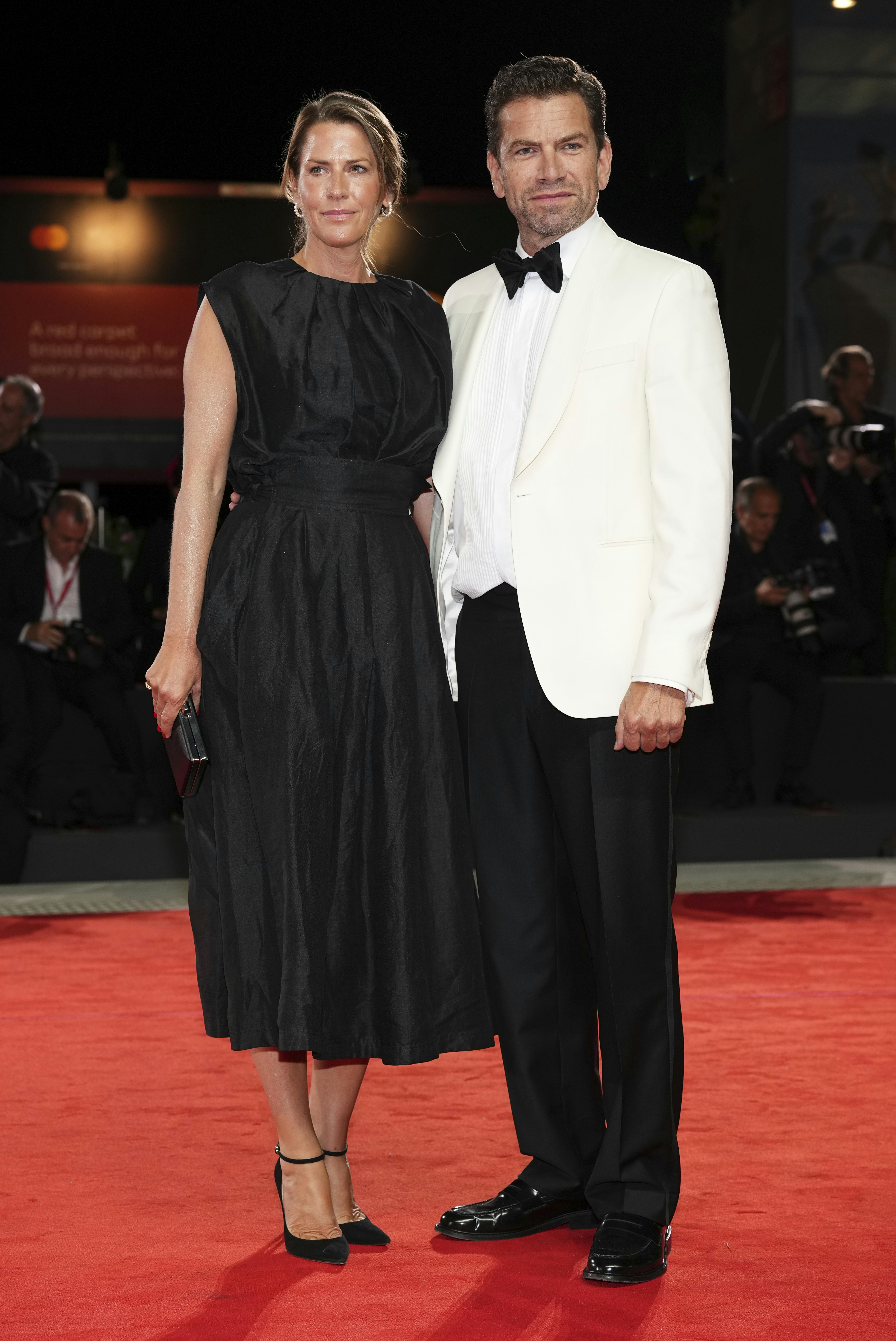 Anne Langkilde, left, and Nikolaj Lie Kaas pose for photographers at the red carpet for the film 'The Last Viking' during the 82nd edition of the Venice Film Festival in Venice, Italy, on Saturday, Aug. 30, 2025. (Photo by Scott A Garfitt/Invision/AP)