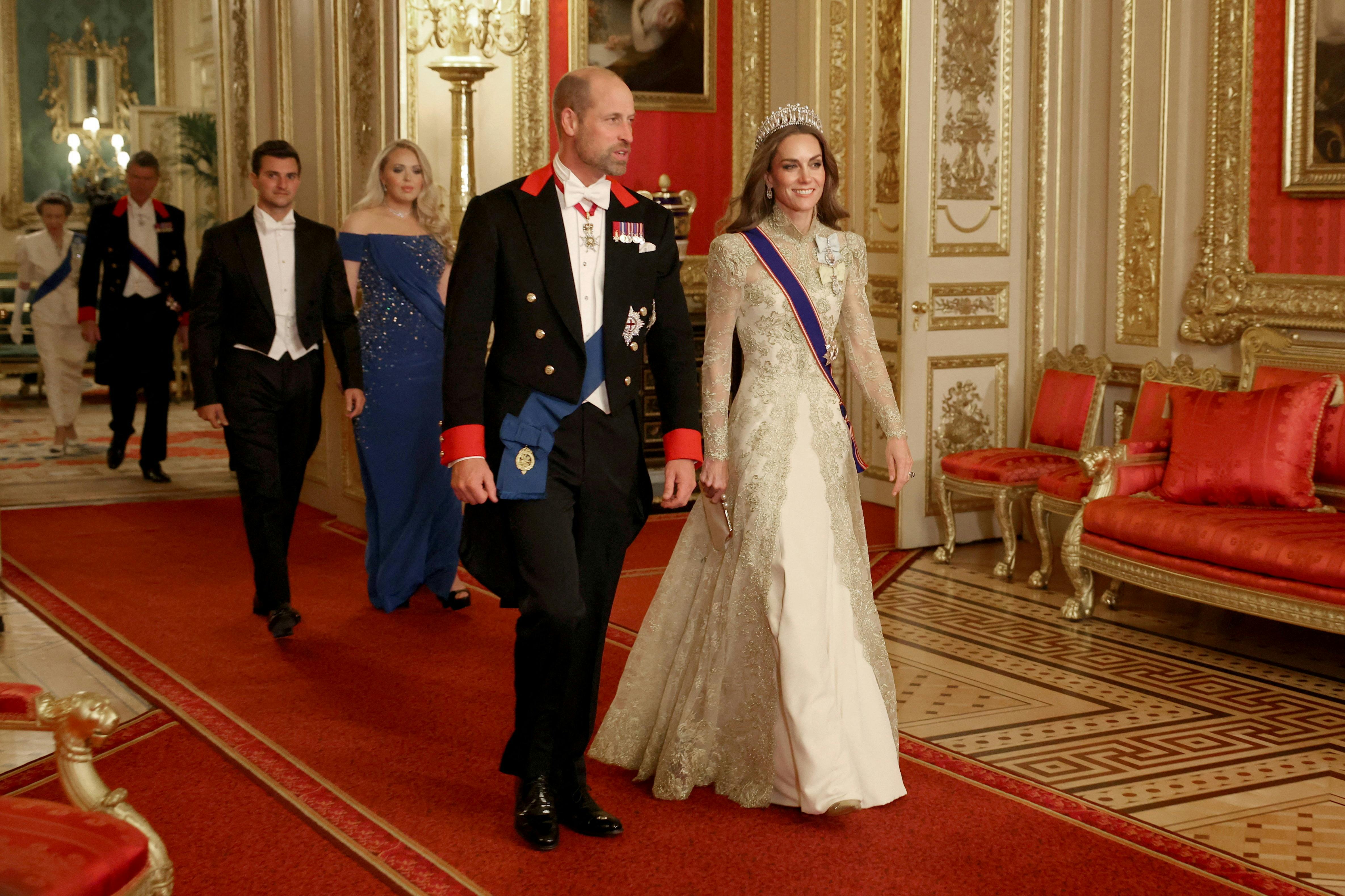 Britain's William, Prince of Wales and Catherine, Princess of Wales walk to attend the State Banquet during U.S. President Donald Trump's state visit, at Windsor Castle, in Windsor, Britain, September 17, 2025. REUTERS/Phil Noble/Pool