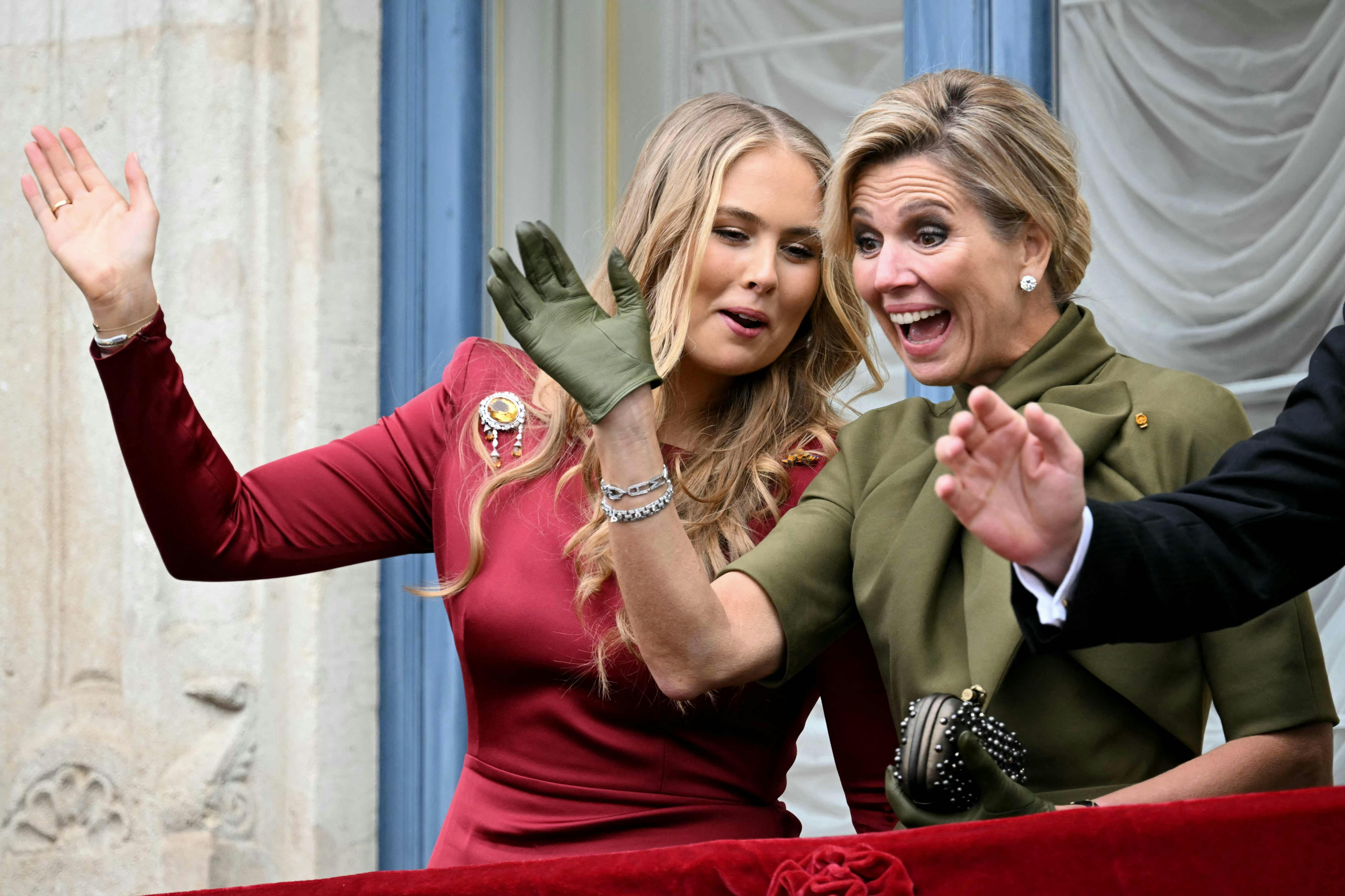 The Netherlands' Crown Princess Catharina-Amalia (L) and Queen Maxima (R) wave from the balcony of the Grand Ducal Palace after attending the swearing-in of Luxembourg's Grand Duke Head of State and Duchess in Luxembourg city on October 3, 2025. Luxembourg will enthrone a new sovereign today with Prince Guillaume set to succeed his father, Grand Duke Henri, who officially abdicates on the same day, ending a 25-year reign. (Photo by NICOLAS TUCAT / AFP)